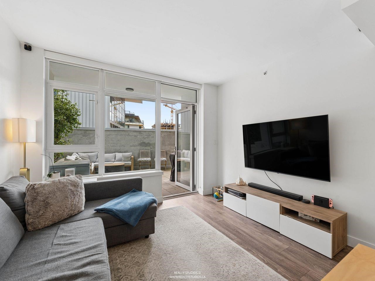 205-8538 River District Crossing, Vancouver, BC - Indoor Photo Showing Living Room