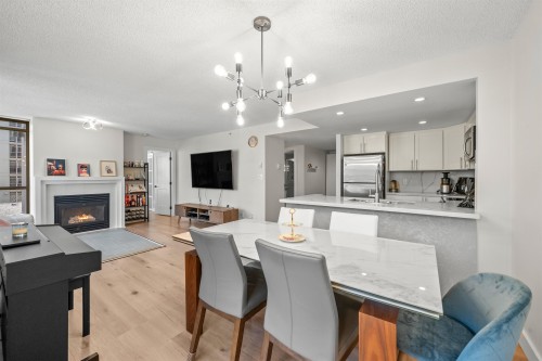 706-867 Hamilton Street, Vancouver, BC - Indoor Photo Showing Dining Room With Fireplace