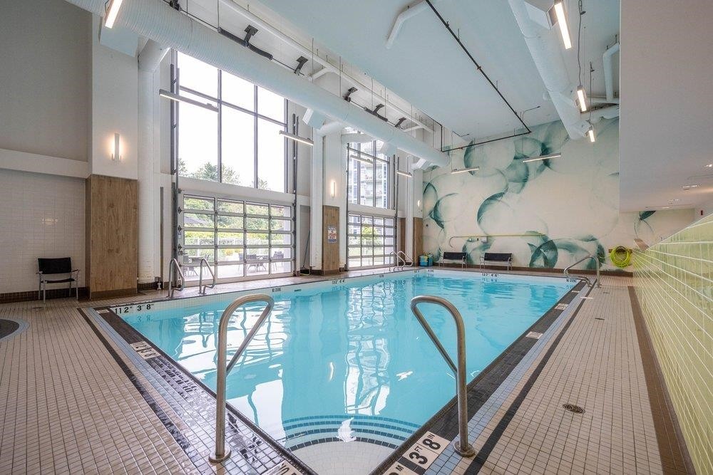 302-8533 River District Crossing, Vancouver, BC - Indoor Photo Showing Other Room With In Ground Pool