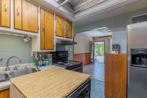 640 Clarke Road, Coquitlam, BC - Indoor Photo Showing Kitchen With Fireplace