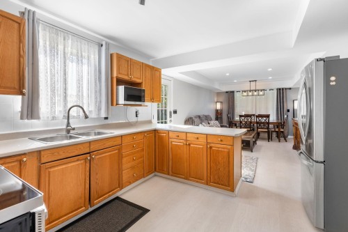 1728 Pekrul Place, Port Coquitlam, BC - Indoor Photo Showing Kitchen With Double Sink
