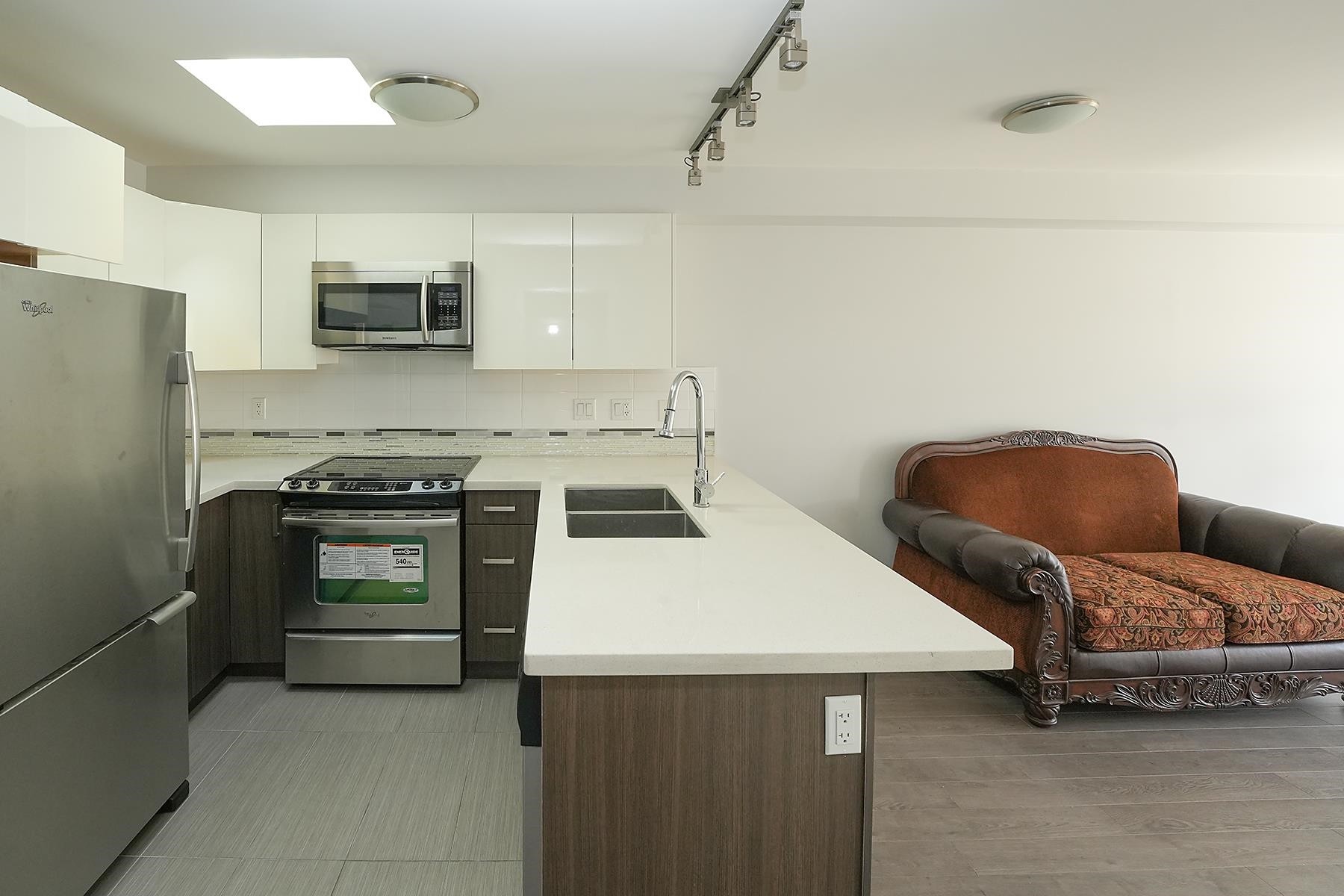 403-2408 Broadway E, Vancouver, BC - Indoor Photo Showing Kitchen With Double Sink