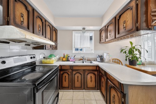 4657 Slocan Street, Vancouver, BC - Indoor Photo Showing Kitchen With Double Sink