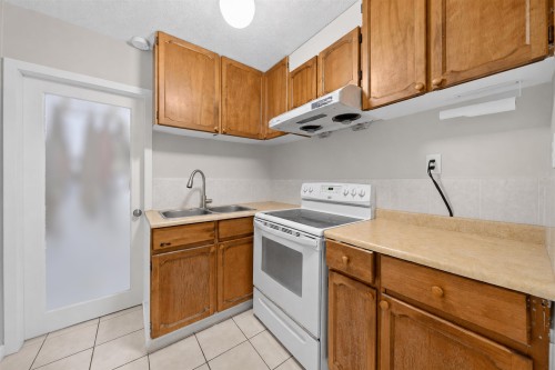 4657 Slocan Street, Vancouver, BC - Indoor Photo Showing Kitchen With Double Sink