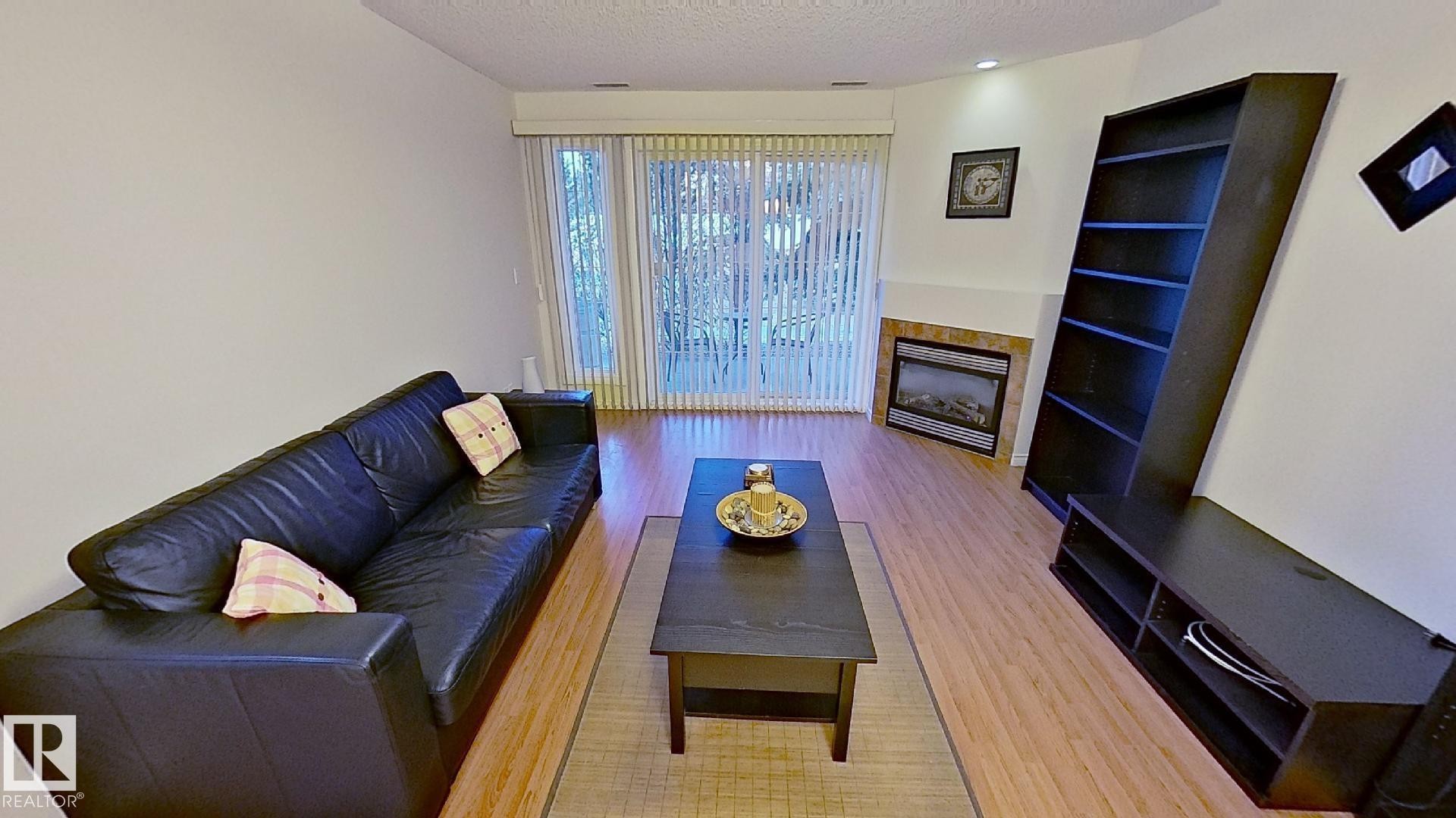 119 12110 106 Avenue Nw, Edmonton, AB - Indoor With Fireplace