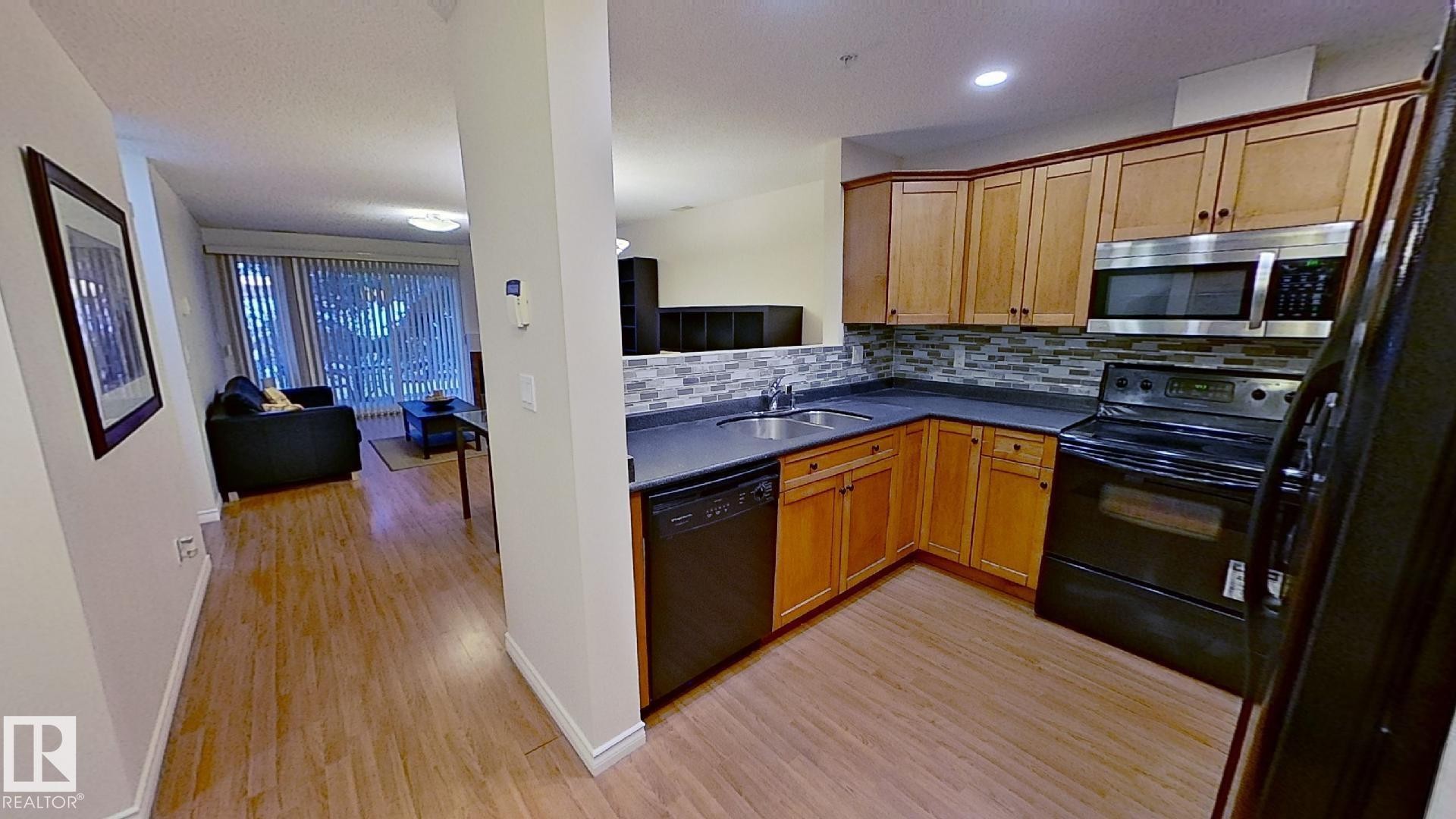 119 12110 106 Avenue Nw, Edmonton, AB - Indoor Photo Showing Kitchen With Double Sink