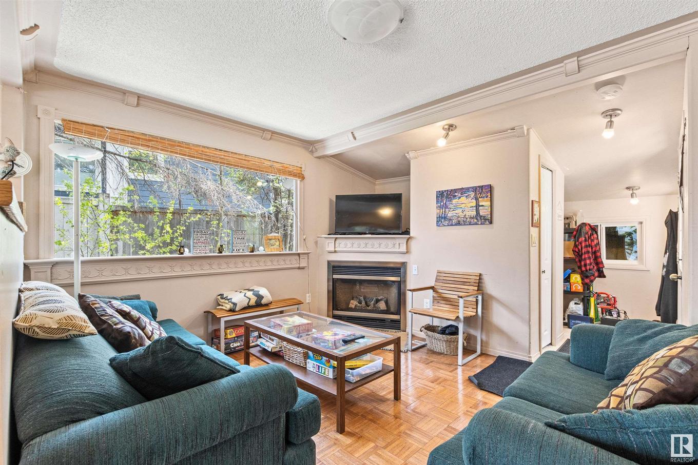 32 Marine Drive, Rural Parkland County, AB - Indoor Photo Showing Living Room With Fireplace
