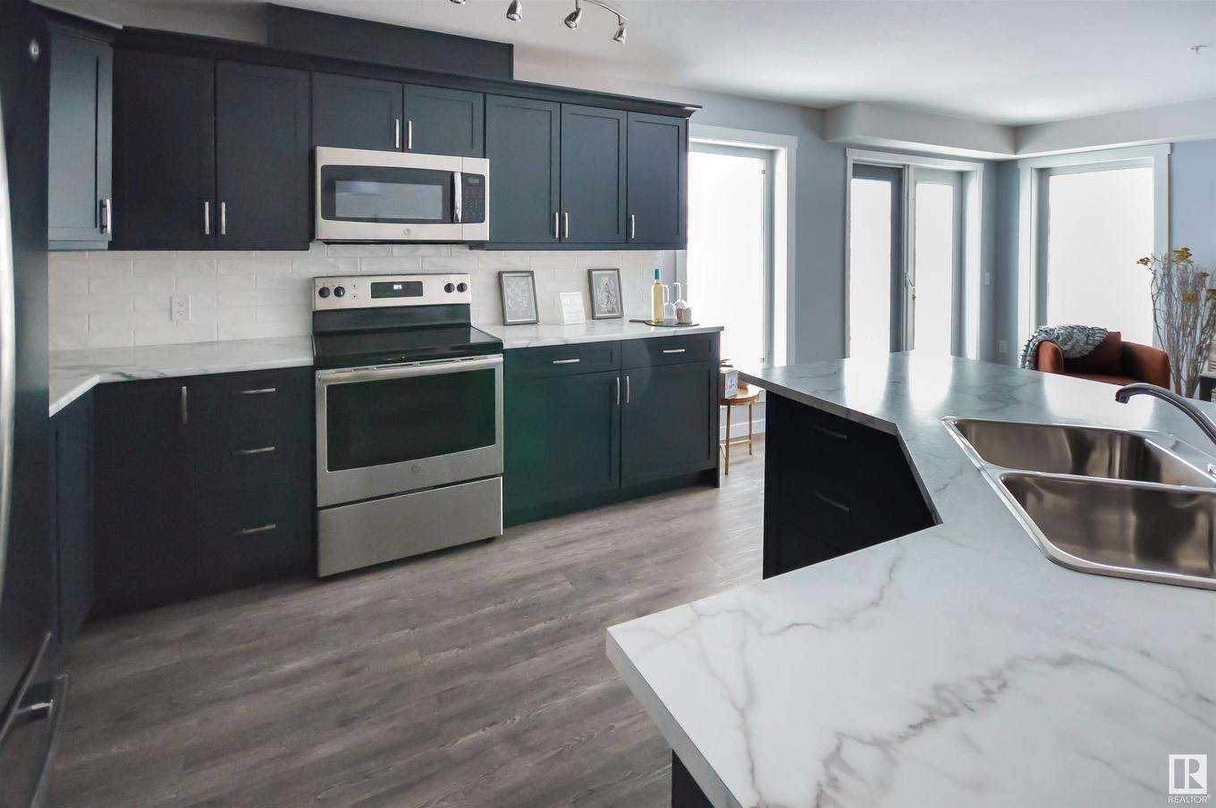 101 4110 43 Avenue, Bonnyville Town, AB - Indoor Photo Showing Kitchen With Double Sink