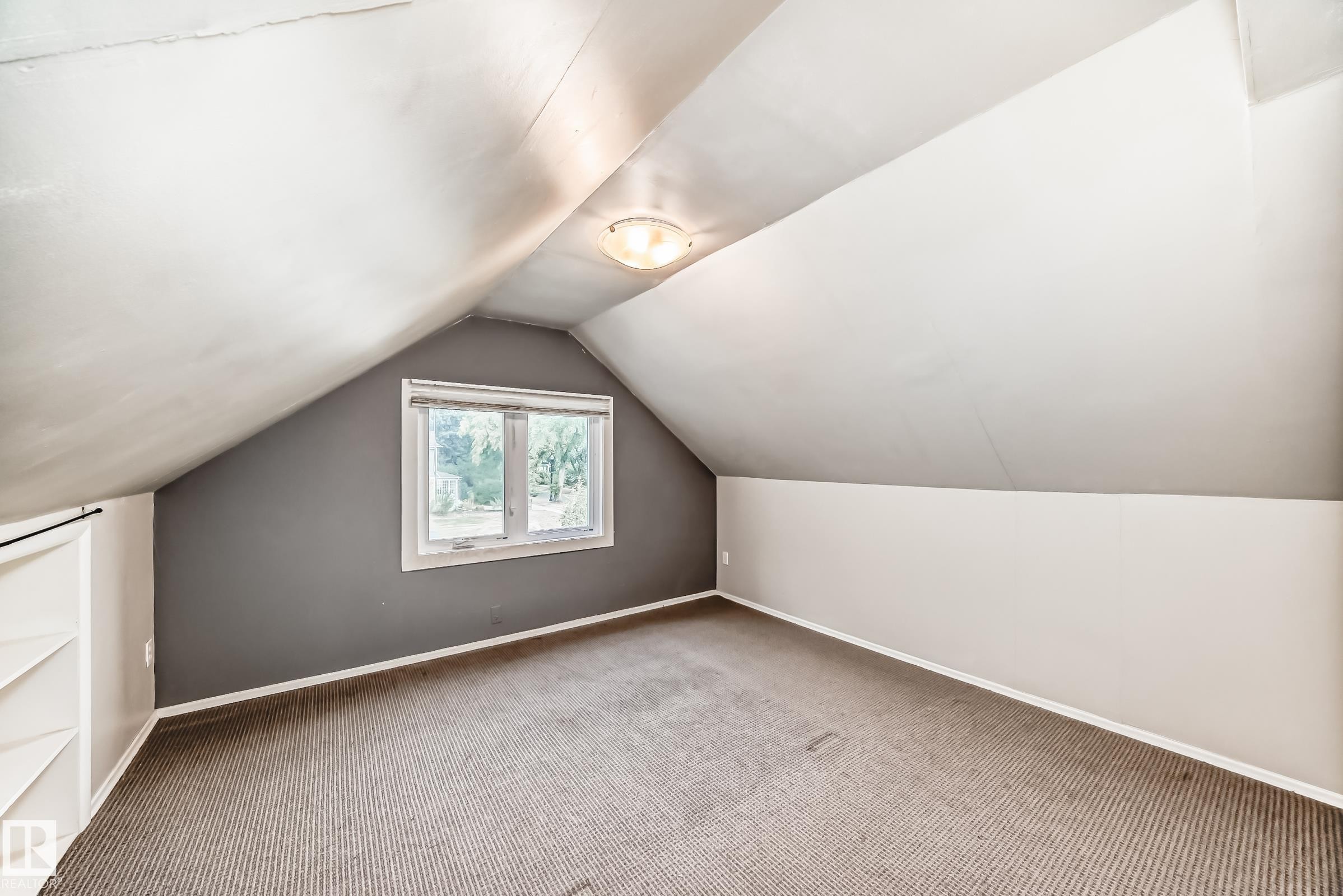 Additional bedroom featuring carpet and lofted ceiling - 12605 107 Avenue, Edmonton, AB - Indoor Photo Showing Other Room