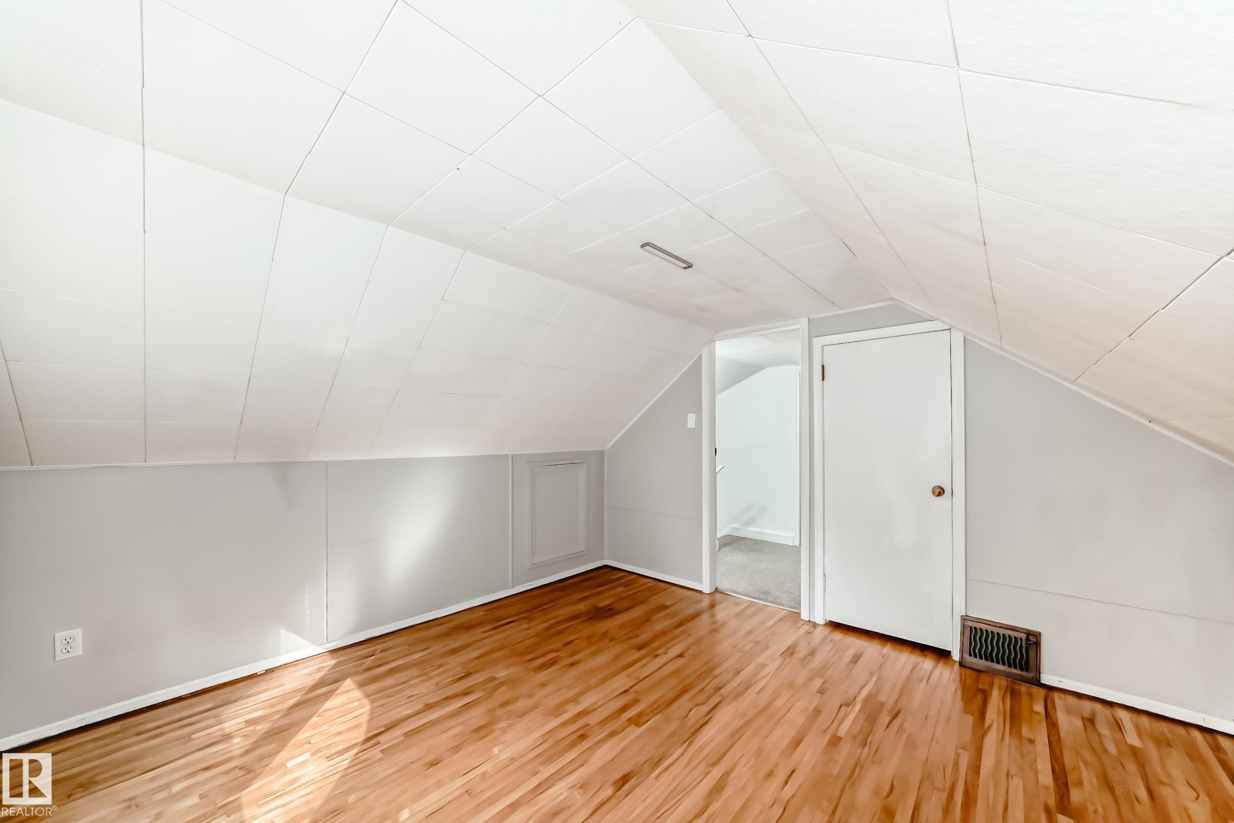 bed room featuring wood finished floors and vaulted ceiling - 12605 107 Avenue, Edmonton, AB - Indoor Photo Showing Other Room
