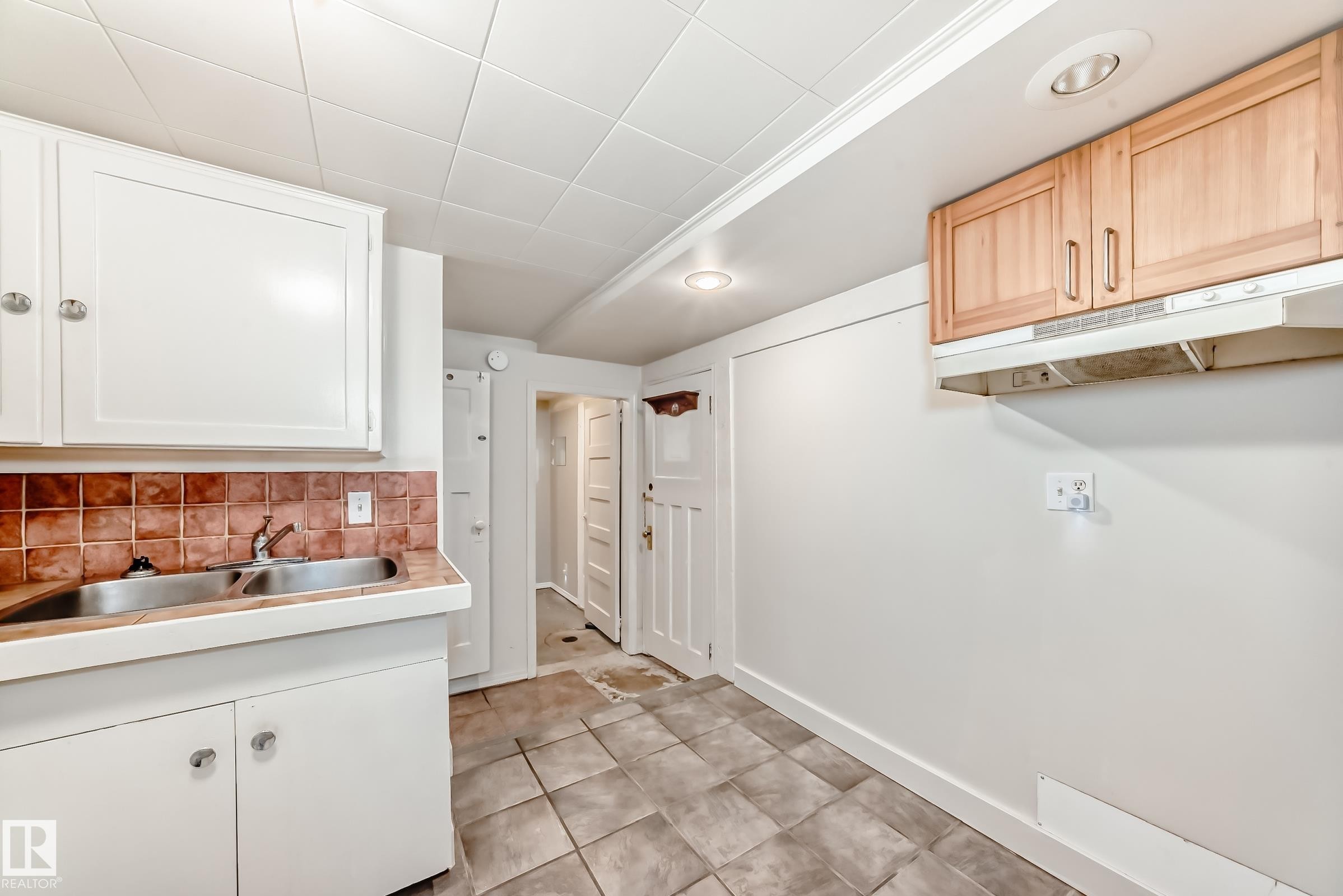 kitchen featuring a sink and light tile patterned flooring - 12605 107 Avenue, Edmonton, AB - Indoor