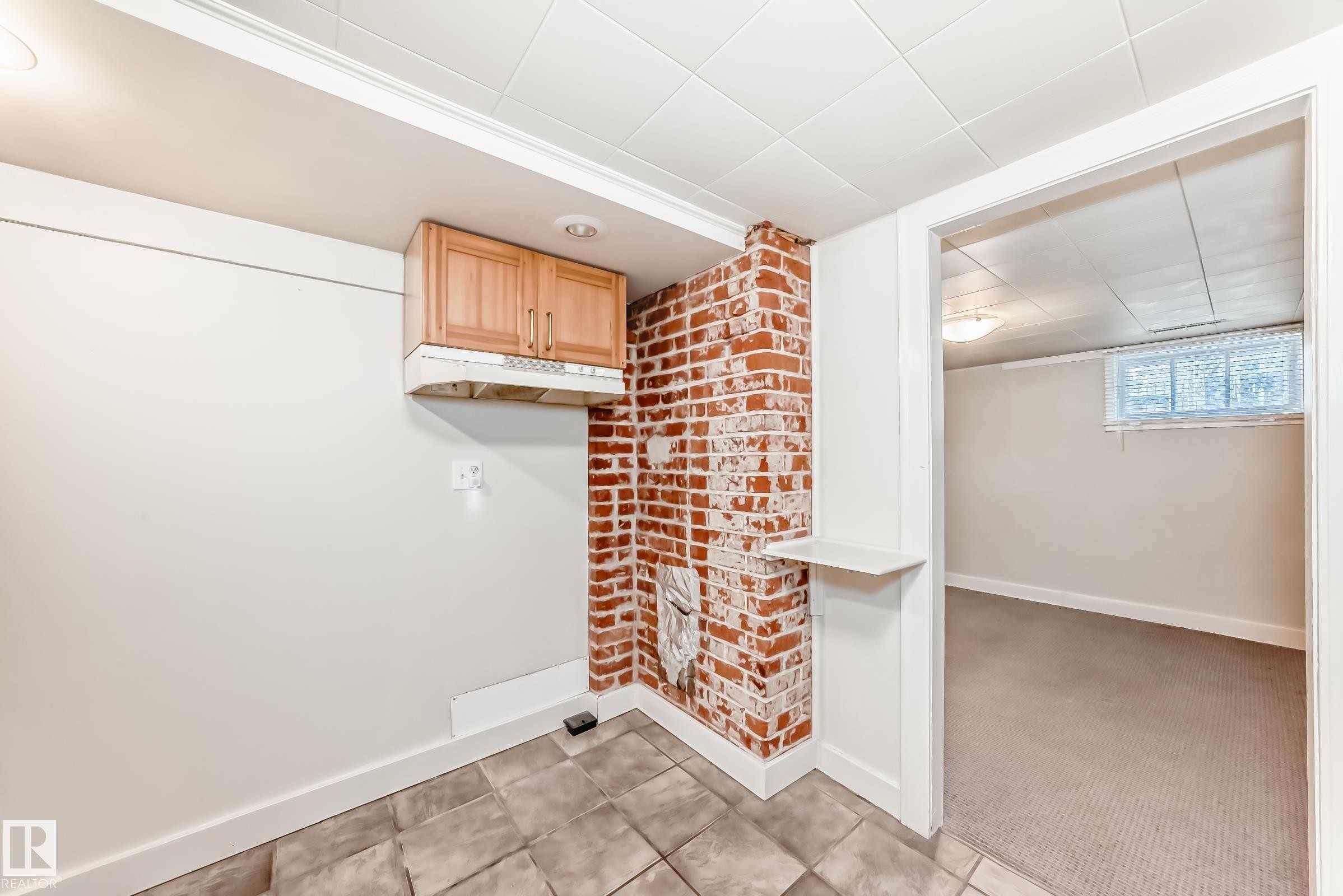 kitchen with light carpet and light tile patterned floors - 12605 107 Avenue, Edmonton, AB - Indoor Photo Showing Other Room