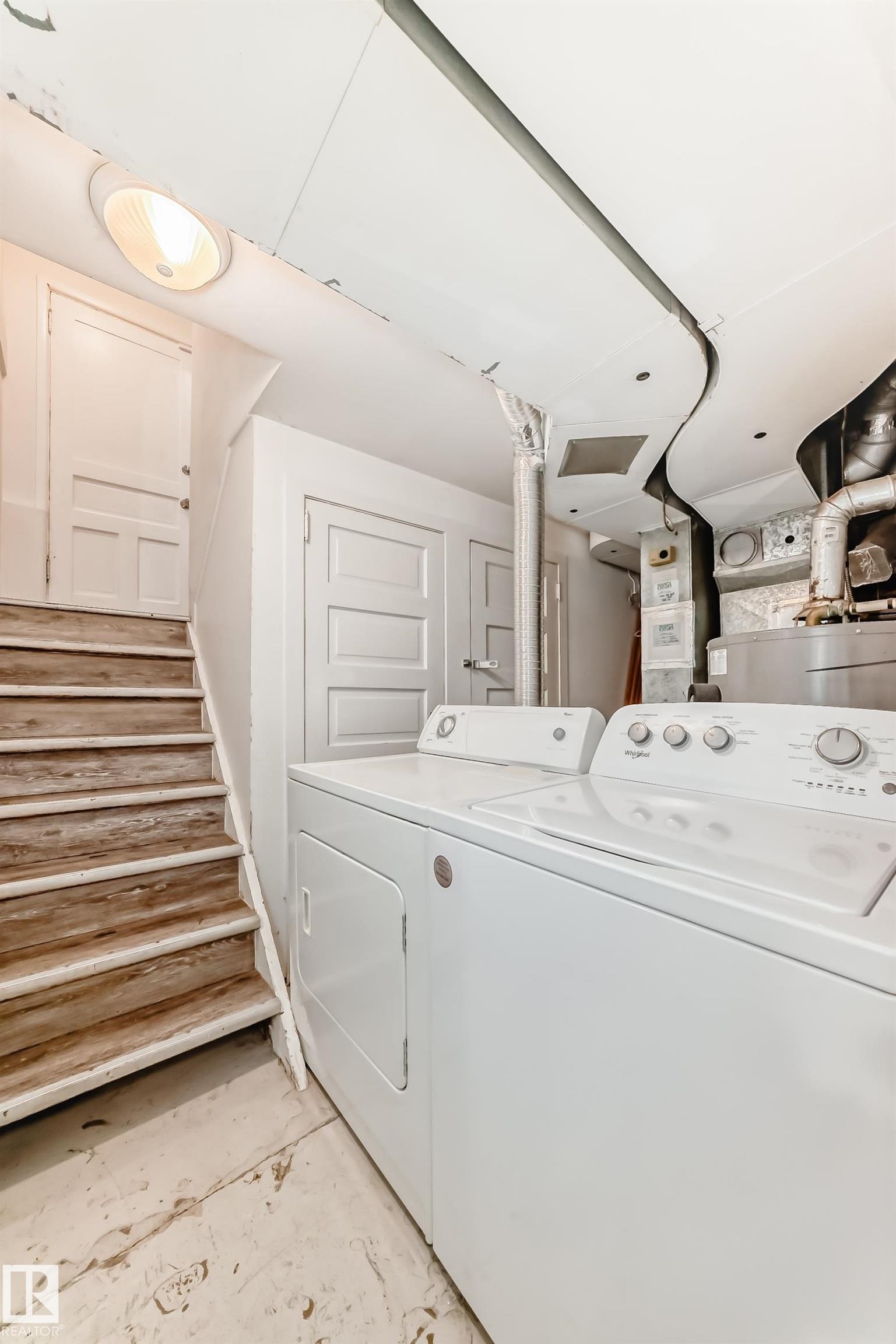 Washroom with independent washer and dryer - 12605 107 Avenue, Edmonton, AB - Indoor Photo Showing Laundry Room