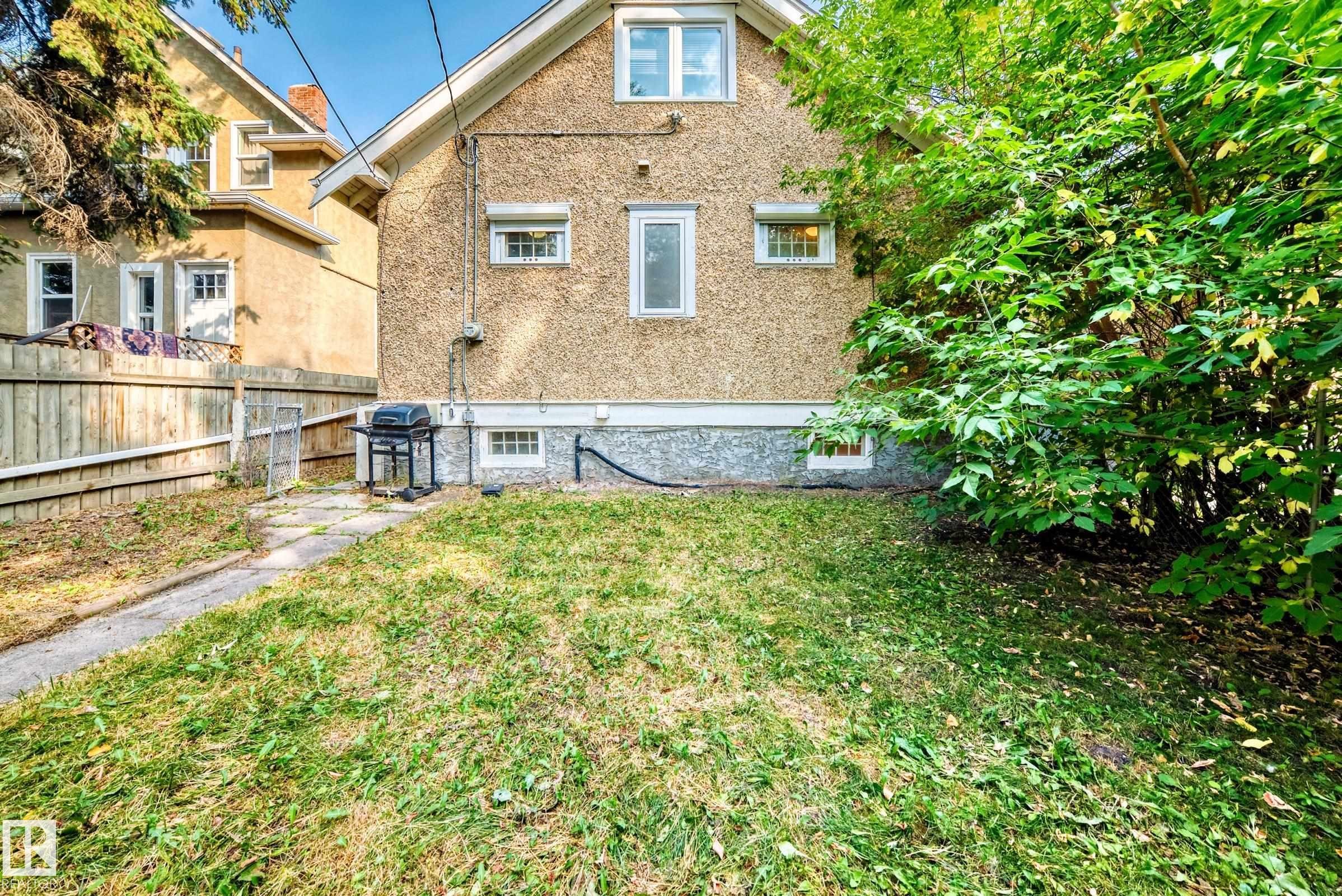 Rear view of property with stucco siding - 12605 107 Avenue, Edmonton, AB - Outdoor