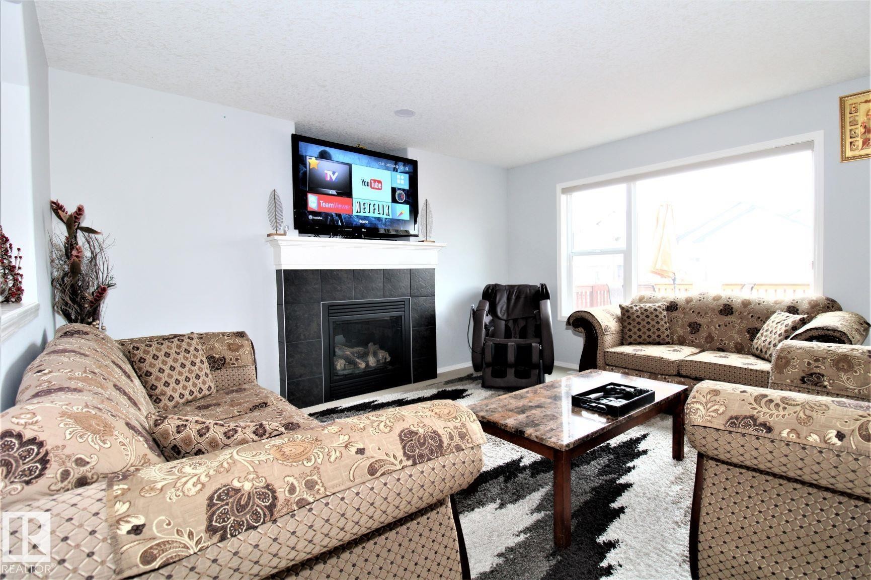 1218 37 Avenue Nw, Edmonton, AB - Indoor Photo Showing Living Room With Fireplace