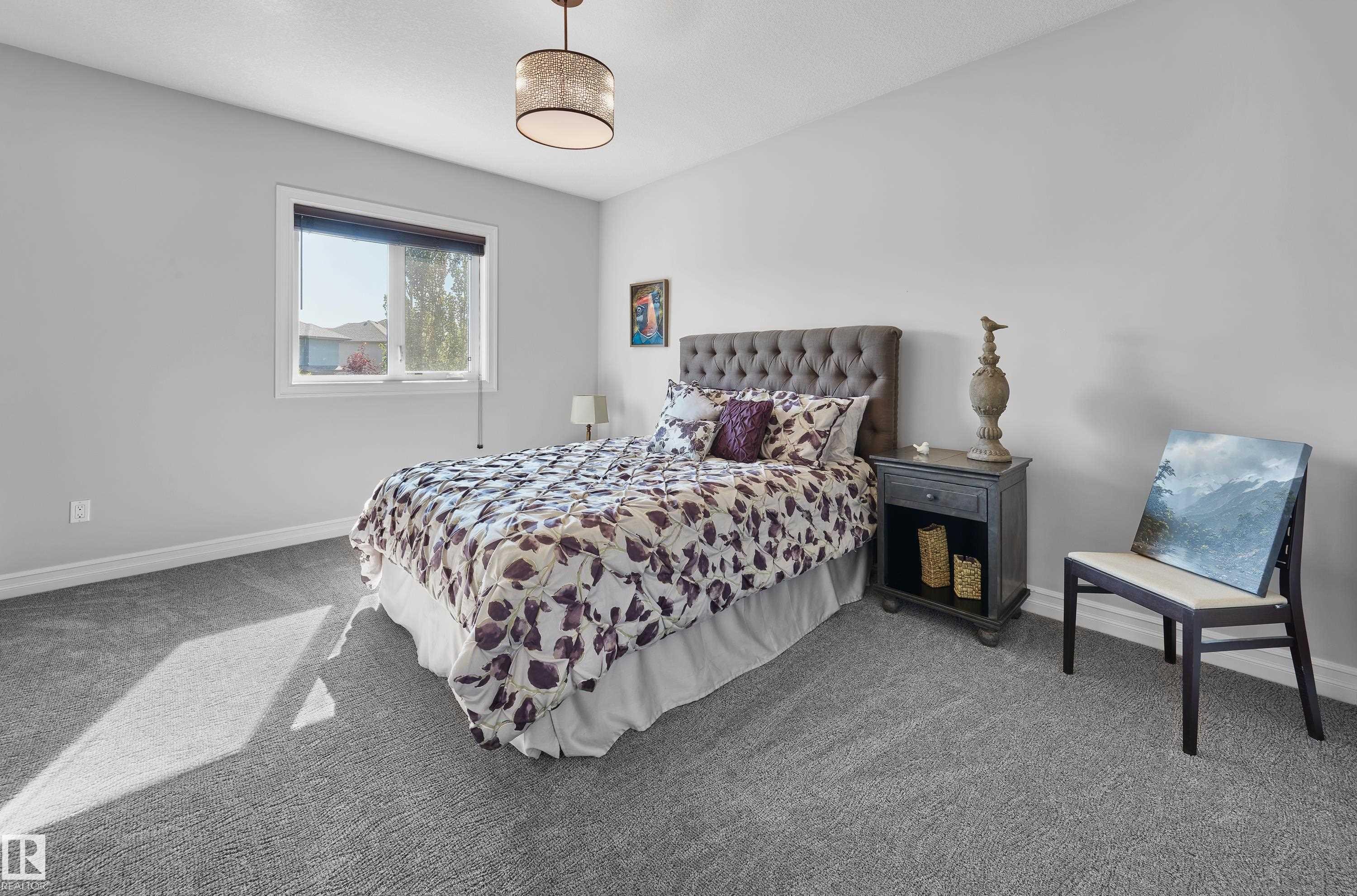 Bedroom with carpet floors and baseboards - 4111 Westcliff Heath Heath, Edmonton, AB - Indoor Photo Showing Bedroom