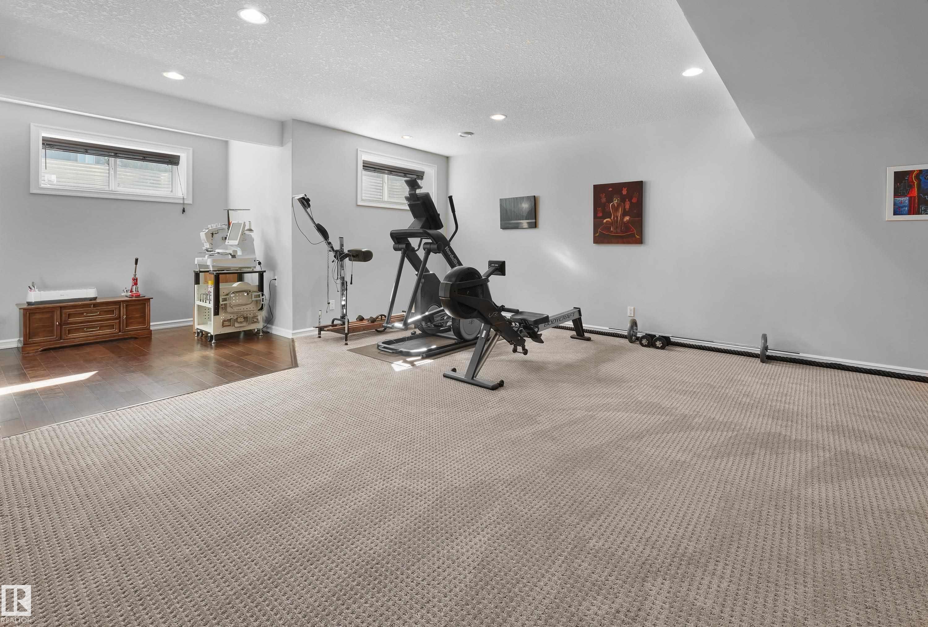 Exercise area featuring a textured ceiling, recessed lighting, and carpet - 4111 Westcliff Heath Heath, Edmonton, AB - Indoor Photo Showing Gym Room