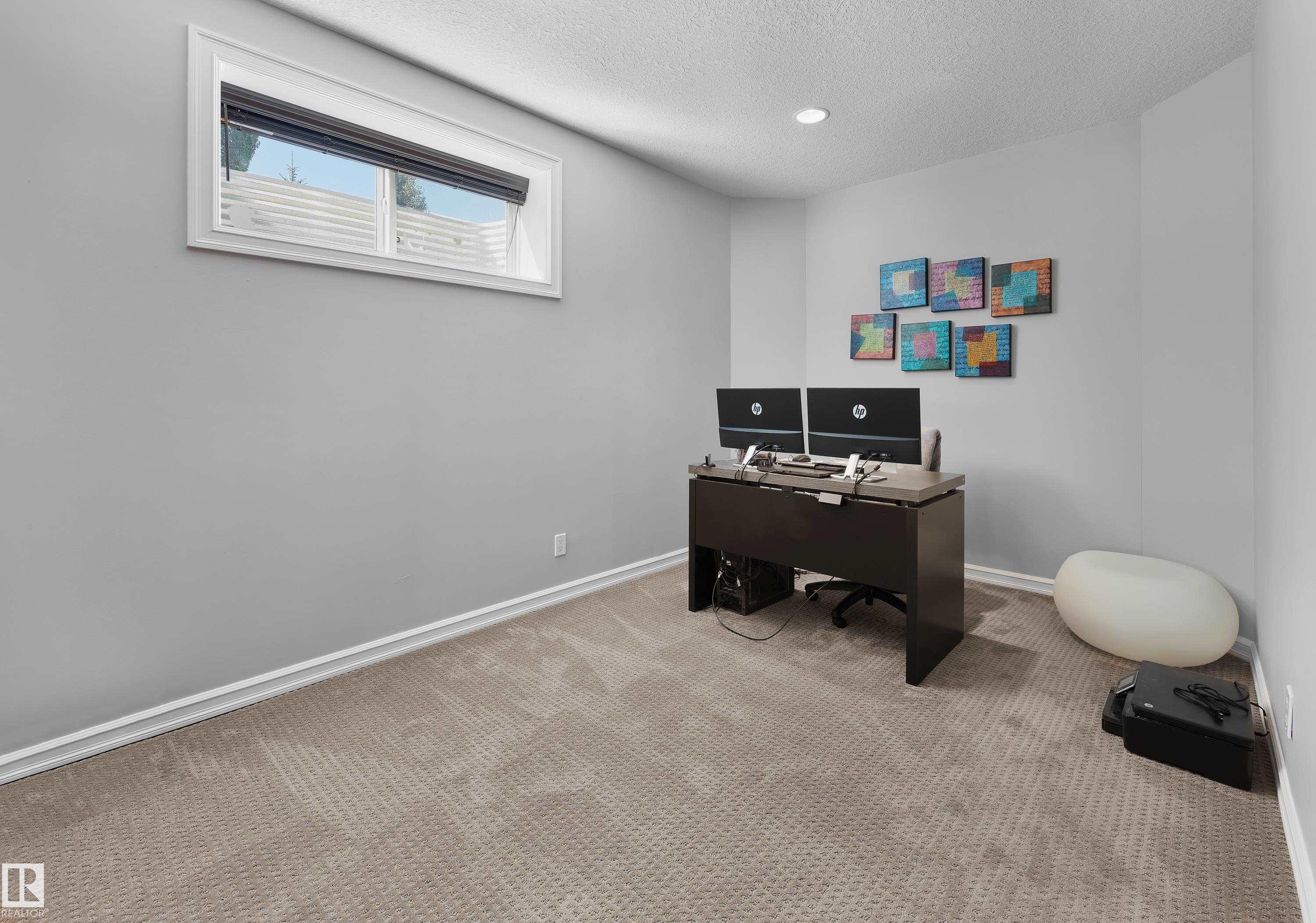Carpeted home office featuring a textured ceiling and recessed lighting - 4111 Westcliff Heath Heath, Edmonton, AB - Indoor