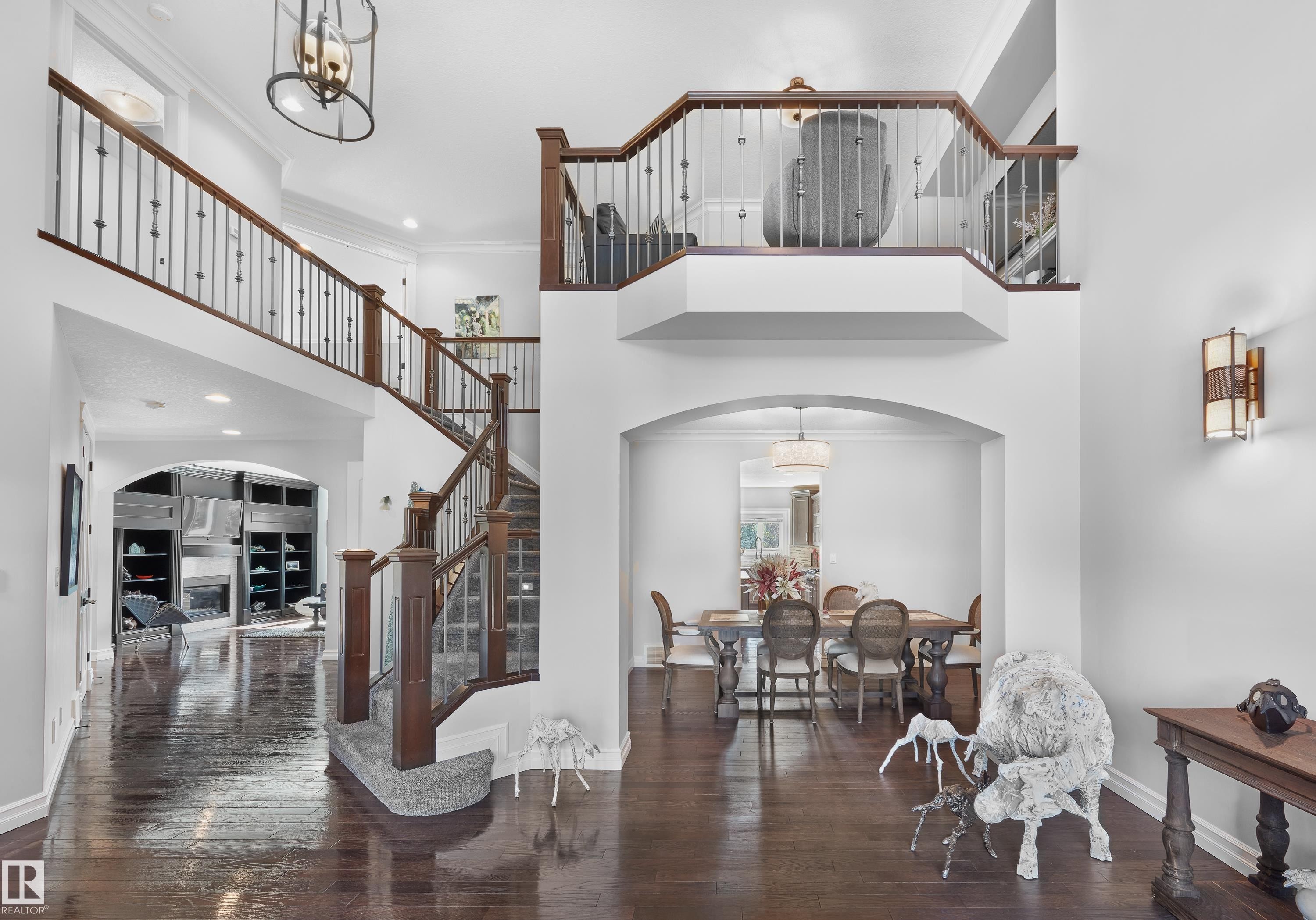 Entrance foyer featuring arched walkways, ornamental molding, hardwood / wood-style floors, a towering ceiling, and recessed lighting - 4111 Westcliff Heath Heath, Edmonton, AB - Indoor Photo Showing Other Room