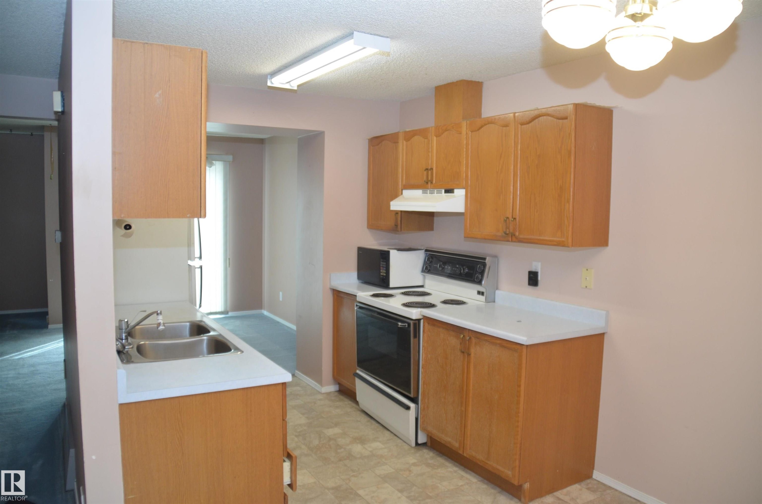 Edmonton, AB - Indoor Photo Showing Kitchen With Double Sink