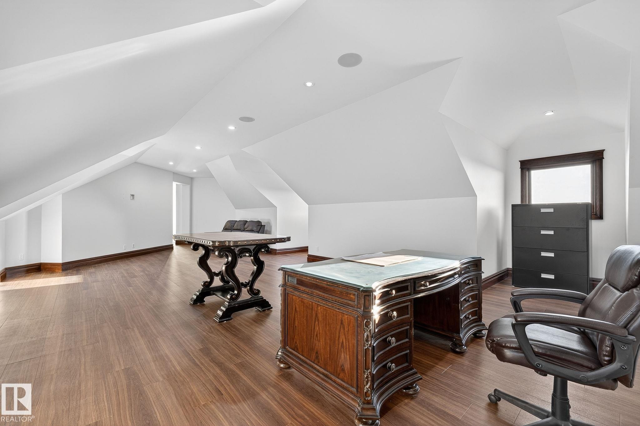 Home office featuring recessed lighting, lofted ceiling, and wood finished floors - 53524 Range Road 263A, Rural Sturgeon County, AB - Indoor