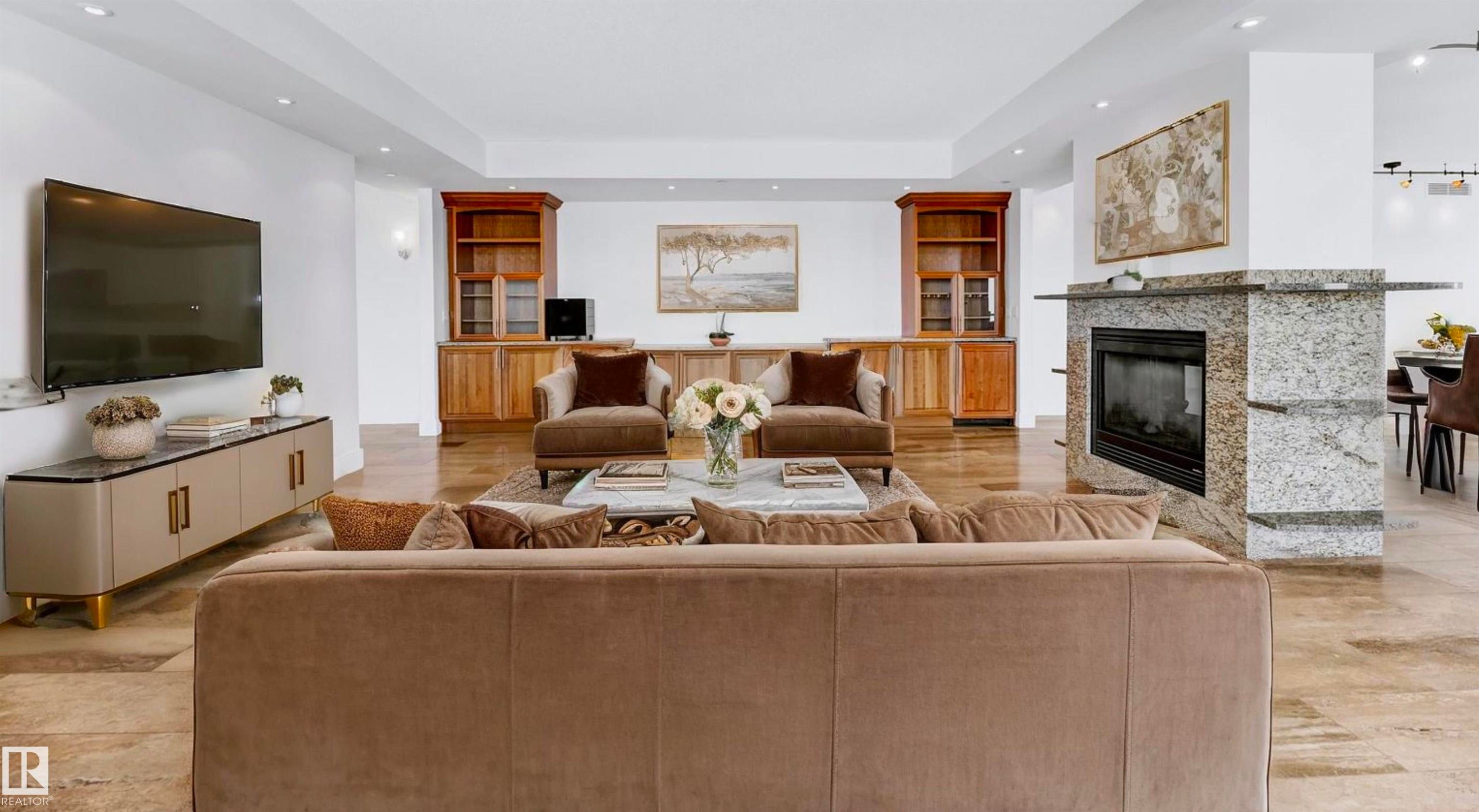 1900 10035 Saskatchewan Drive, Edmonton, AB - Indoor Photo Showing Living Room With Fireplace