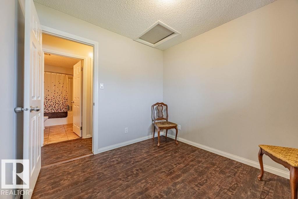 across hall from main bath - 5026 53 Ave, Ryley, AB - Indoor Photo Showing Other Room