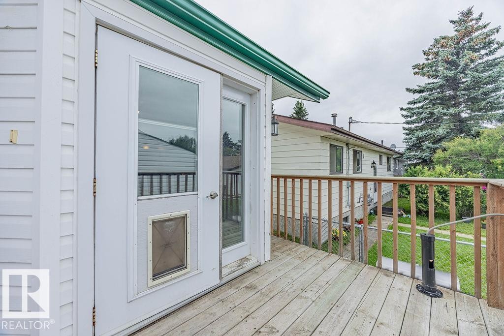 View of deck, dog door - 5026 53 Ave, Ryley, AB - Outdoor With Deck Patio Veranda With Exterior