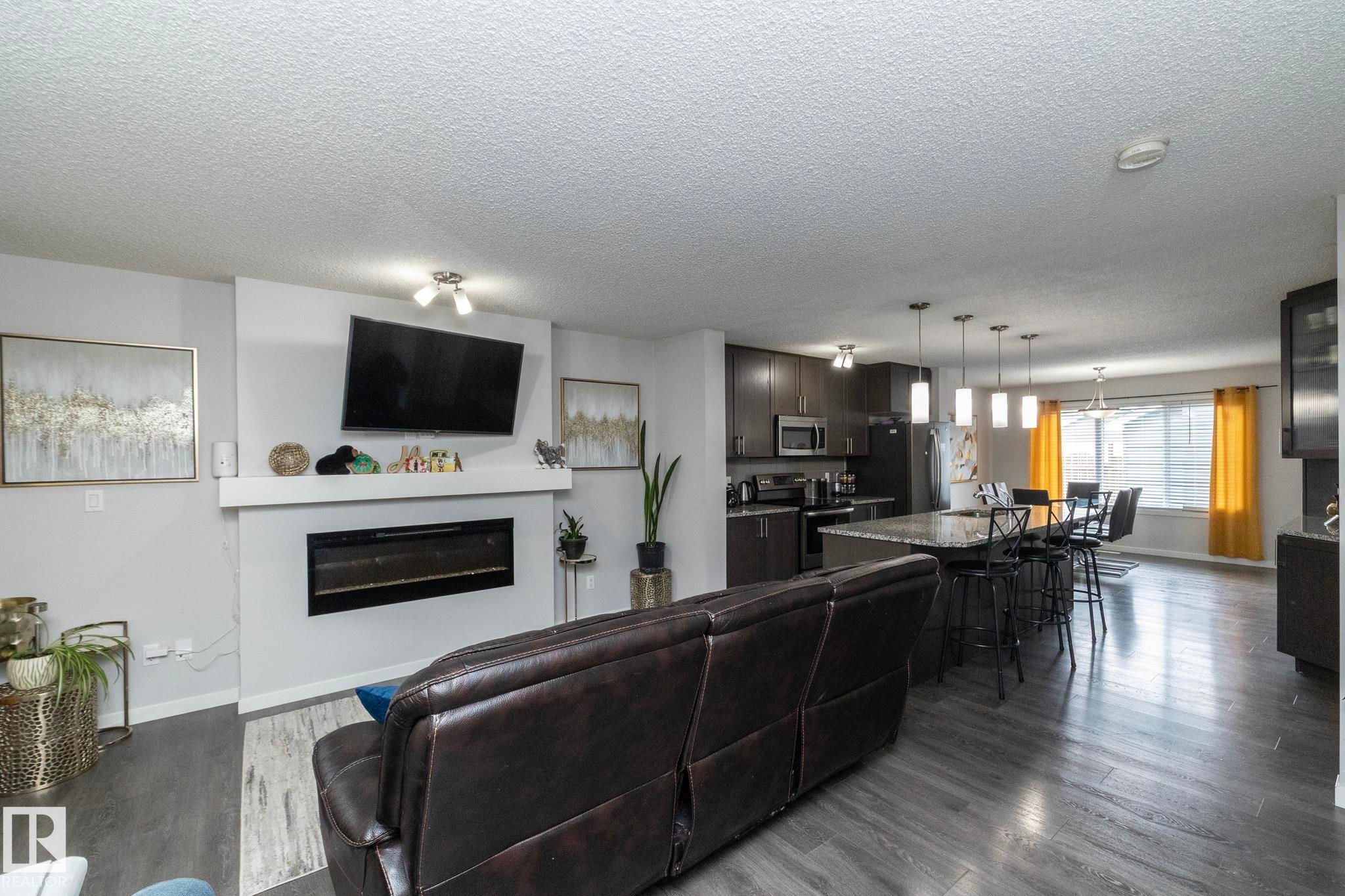 7712 Eifert Crescent, Edmonton, AB - Indoor Photo Showing Living Room With Fireplace