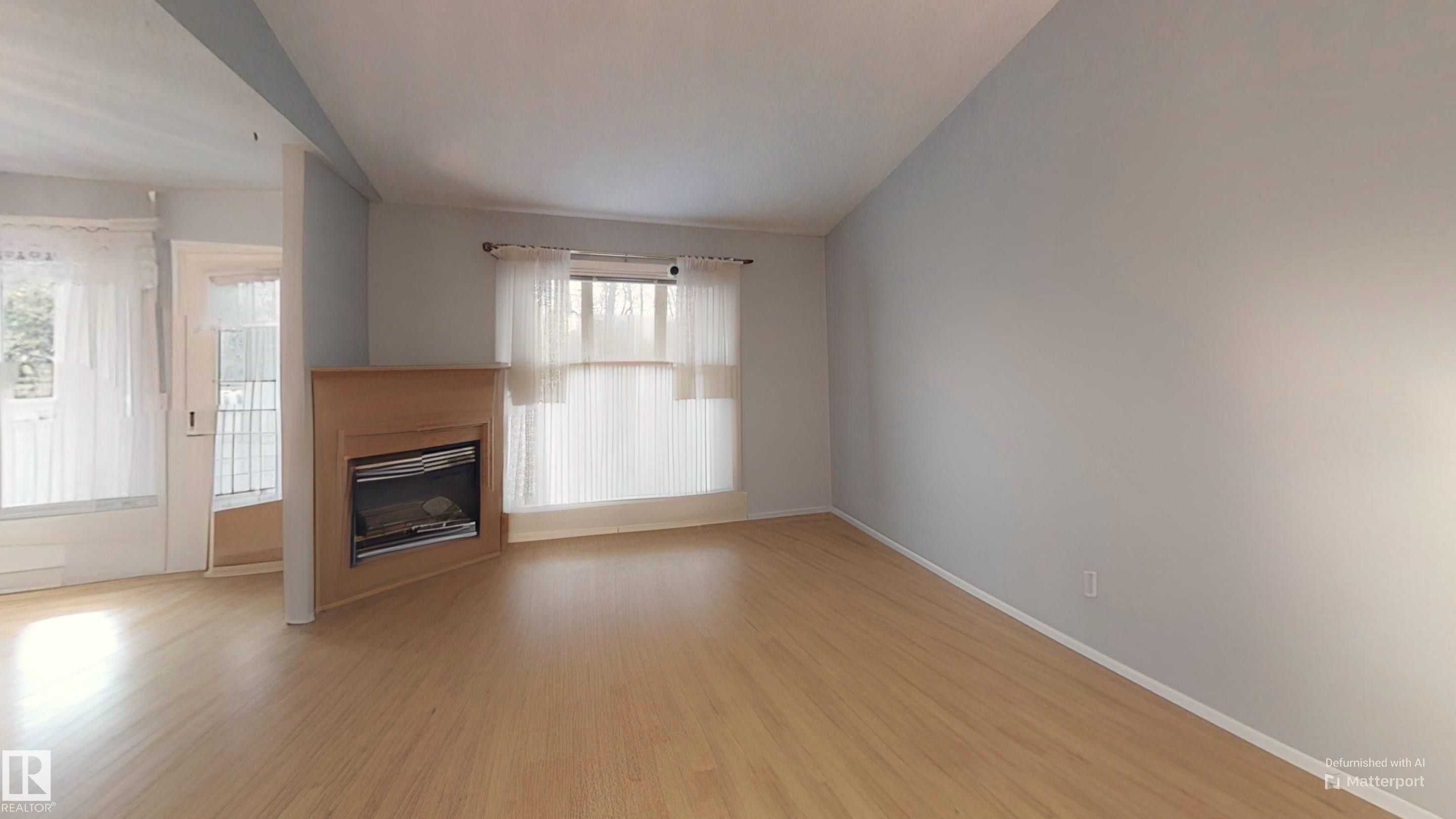 208 Ravine Villa(S), Leduc, AB - Indoor With Fireplace