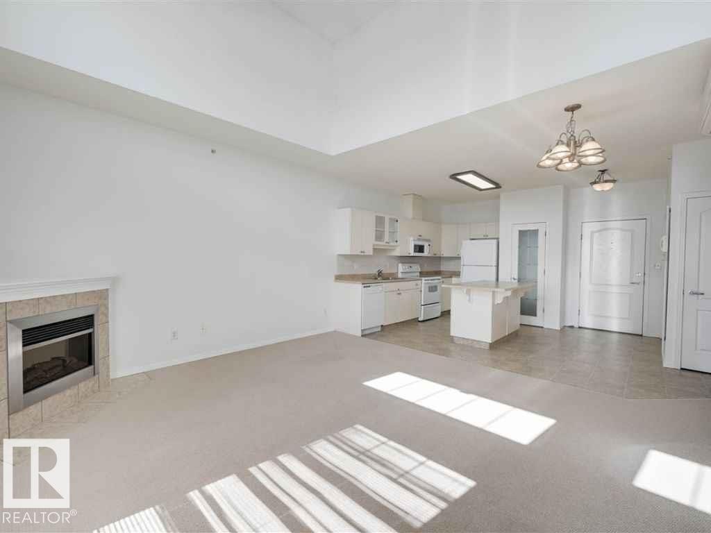 Edmonton, AB - Indoor Photo Showing Living Room With Fireplace