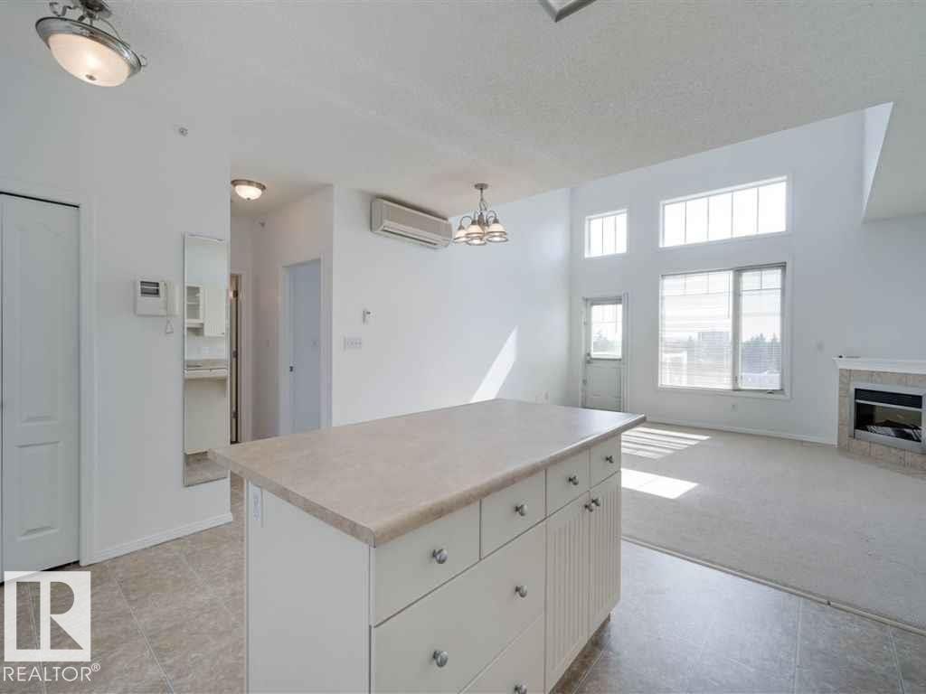 Edmonton, AB - Indoor Photo Showing Other Room With Fireplace