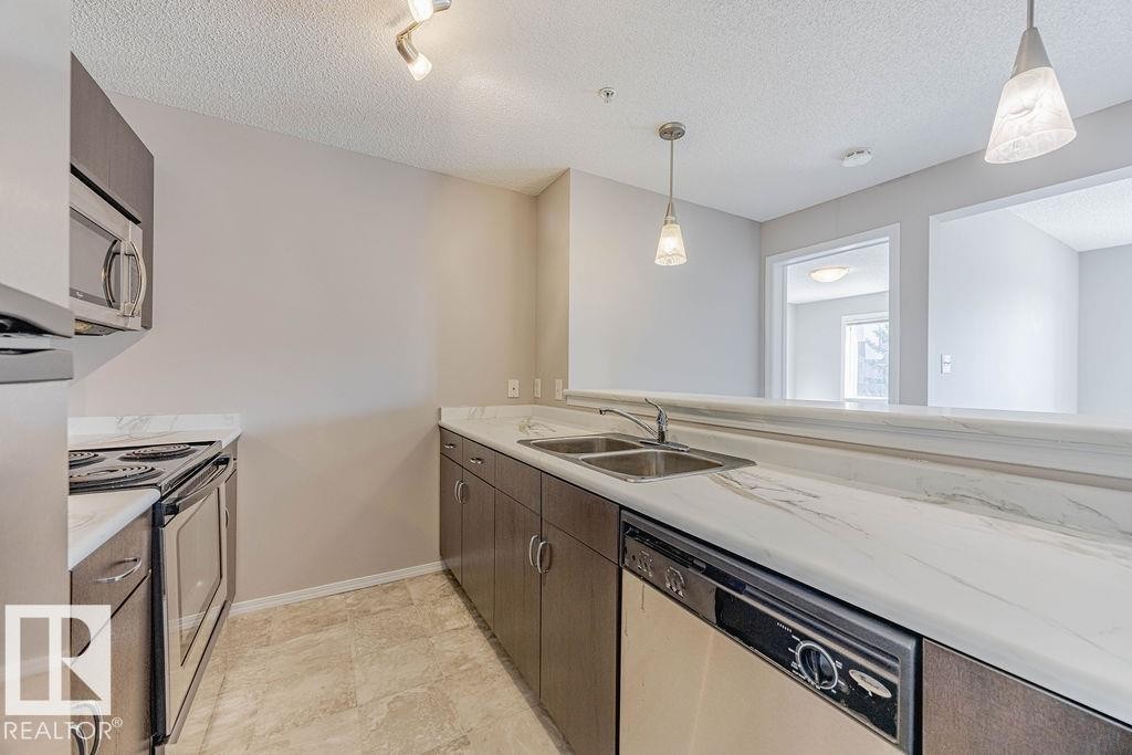 Edmonton, AB - Indoor Photo Showing Kitchen With Double Sink