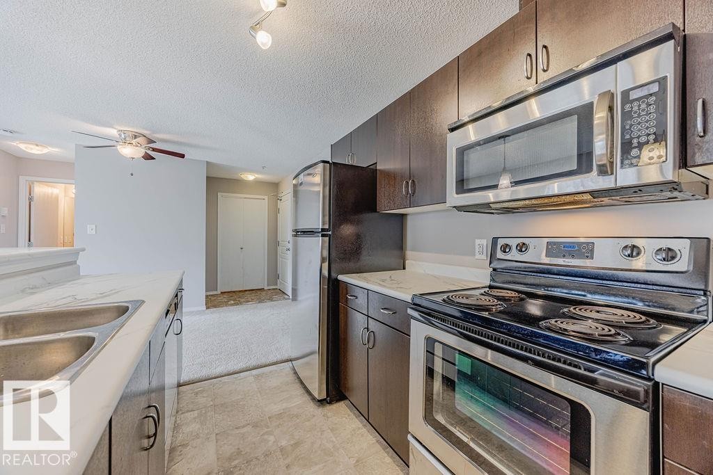Edmonton, AB - Indoor Photo Showing Kitchen With Stainless Steel Kitchen With Double Sink