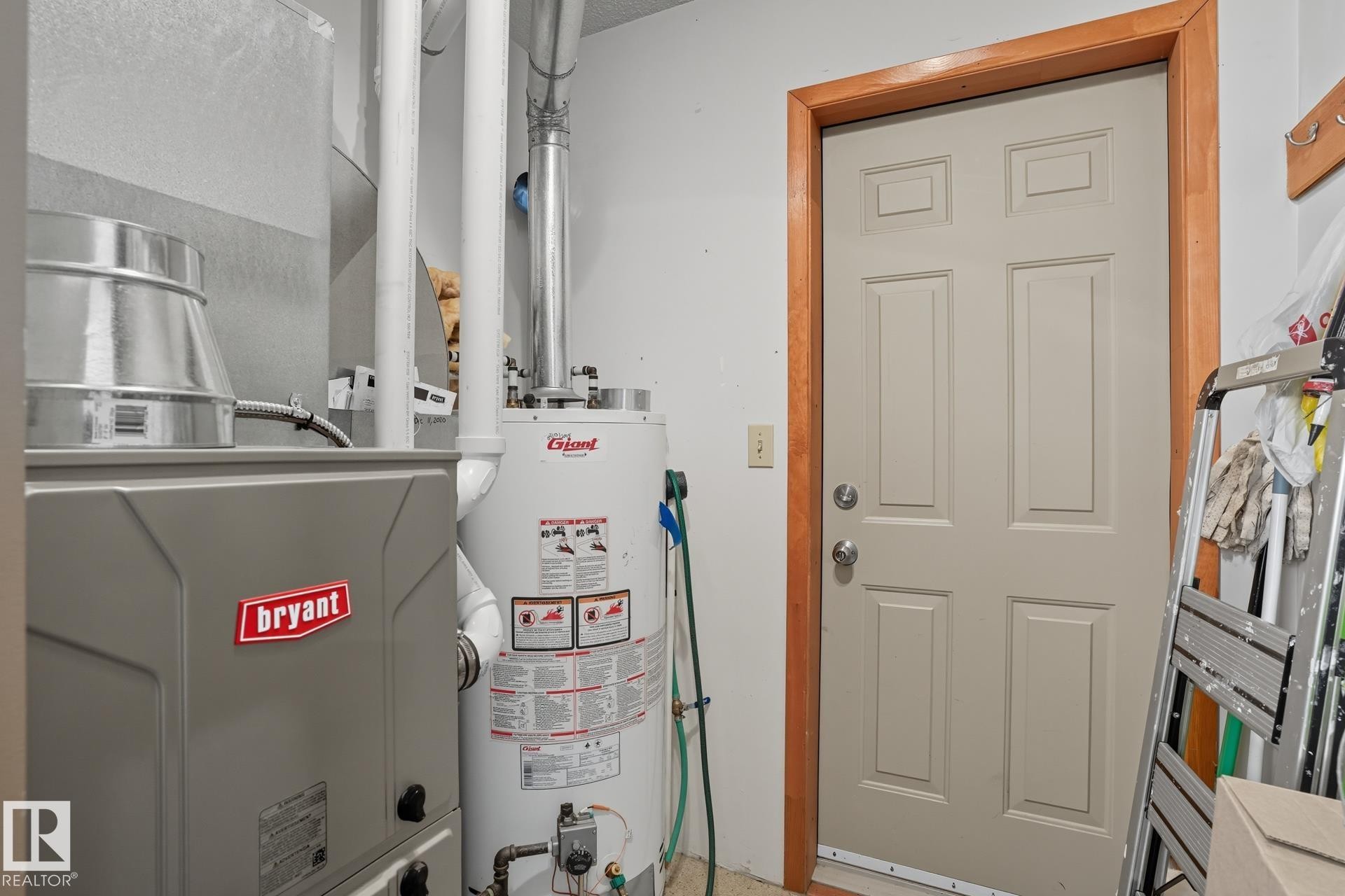 Utilities with gas water heater and heating unit - 6309 49 St, Rural Wetaskiwin County, AB - Indoor Photo Showing Basement