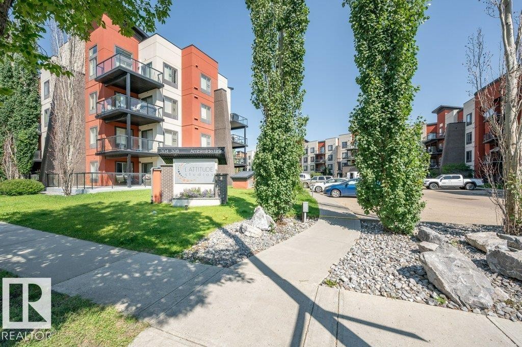 View of home's community with a yard - 140 308 Ambleside Link, Edmonton, AB - Outdoor With Facade