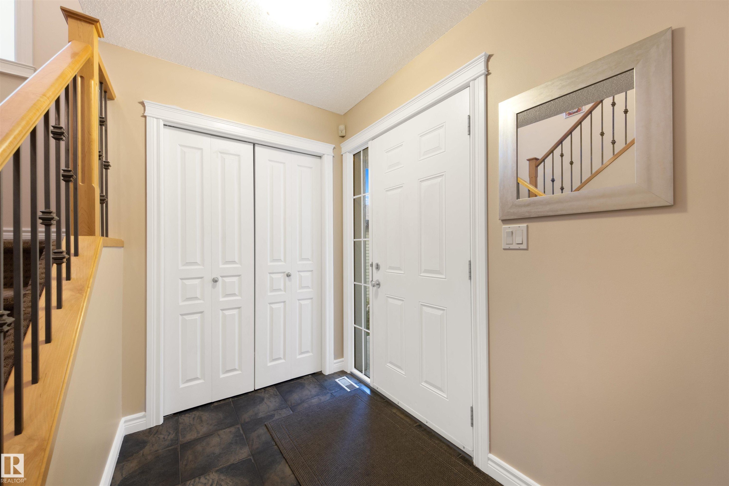 Entryway featuring stairs and a textured ceiling - 2708 Miles Place, Edmonton, AB - Indoor Photo Showing Other Room