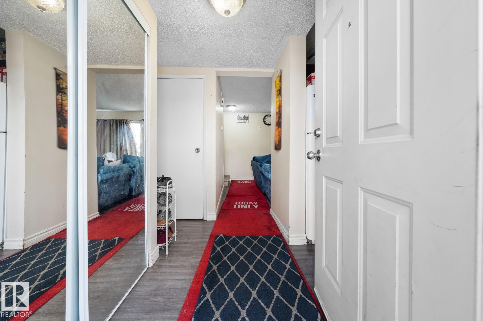 Hall with a textured ceiling and dark wood-style floors - 285 Harrison Drive, Edmonton, AB - Indoor Photo Showing Other Room