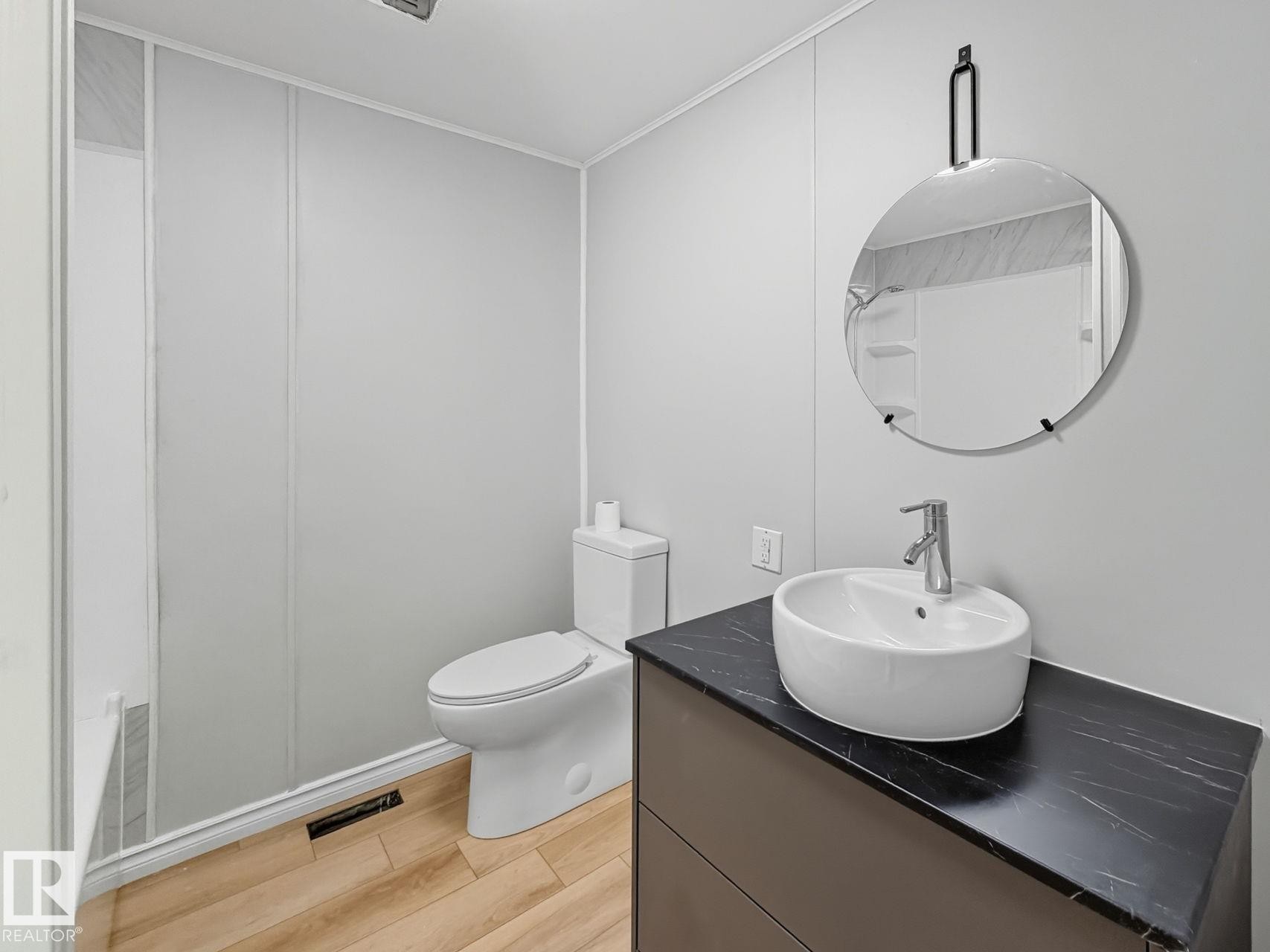 Bathroom with vanity and light wood-style floors - 67 Ridgeway Dr, Edmonton, AB - Indoor Photo Showing Bathroom