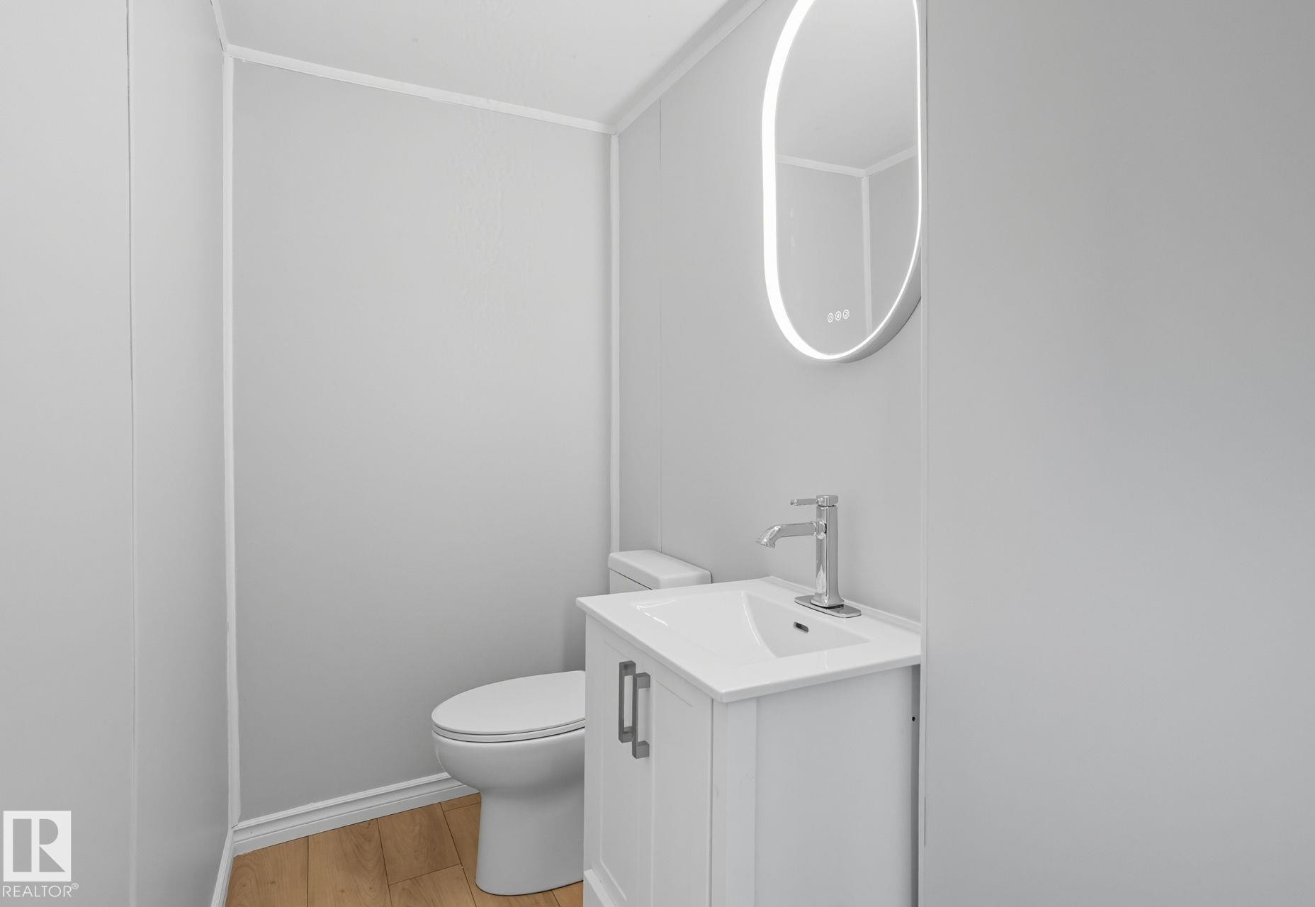 Bathroom featuring vanity and light wood-type flooring - 67 Ridgeway Dr, Edmonton, AB - Indoor Photo Showing Bathroom