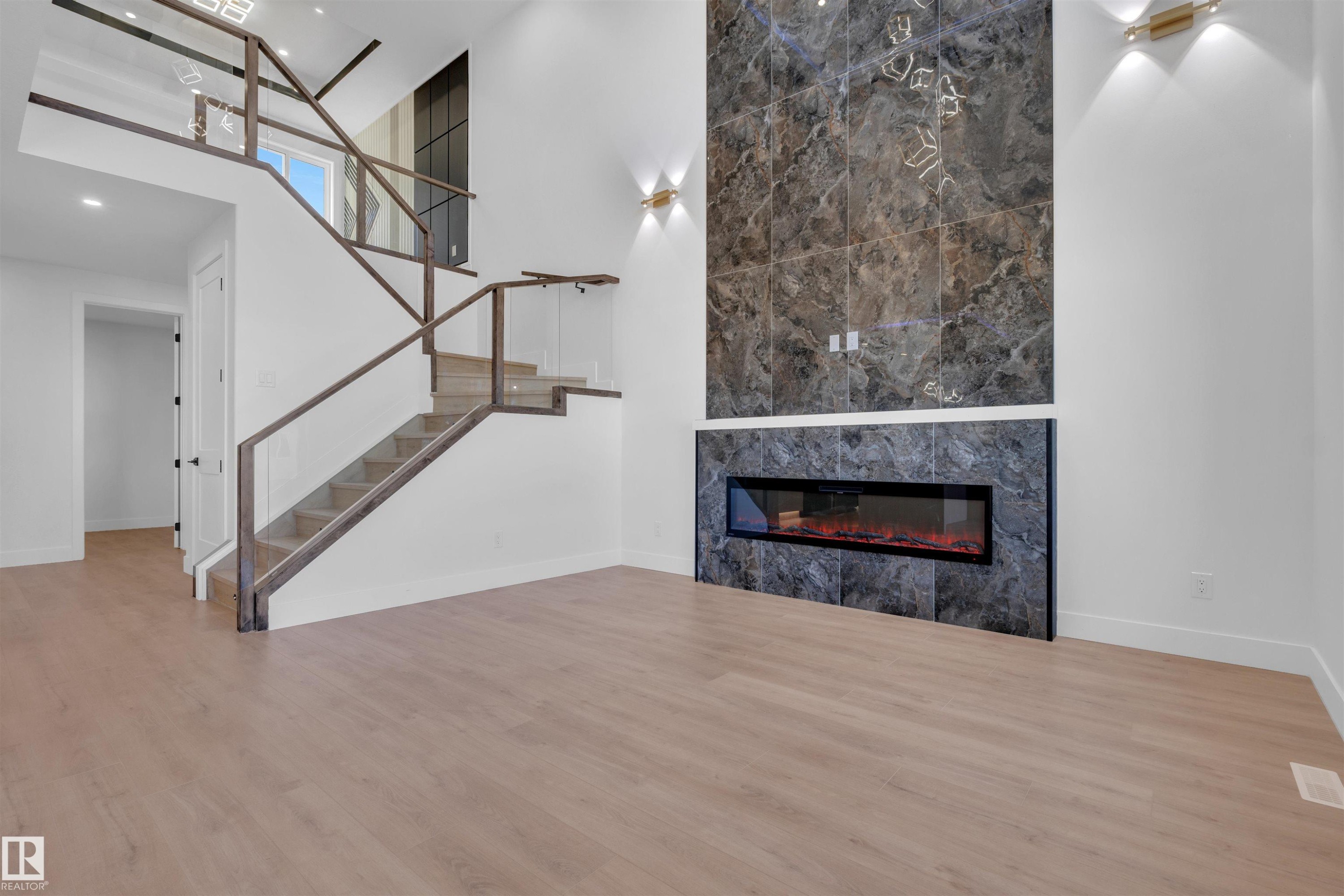 417 Pine Point(E), Leduc, AB - Indoor Photo Showing Other Room With Fireplace