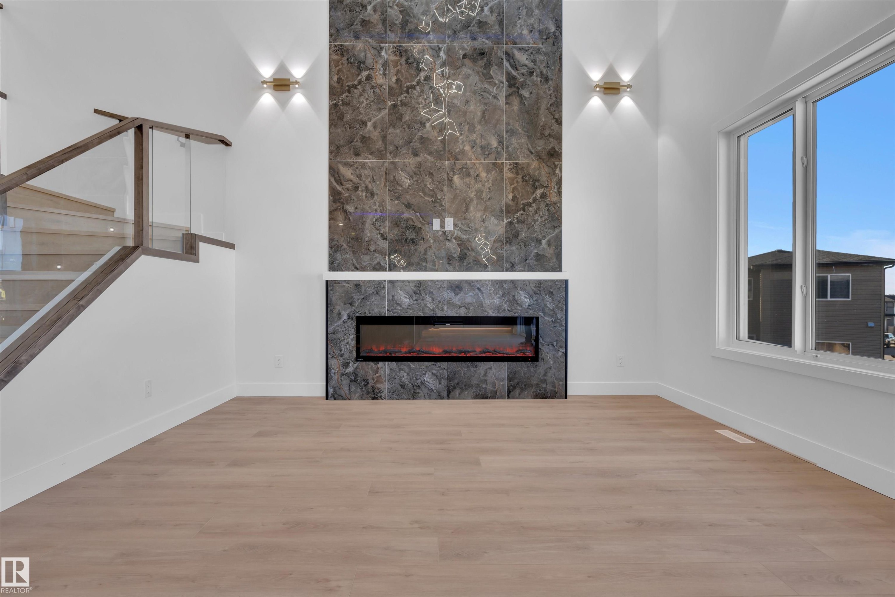 417 Pine Point(E), Leduc, AB - Indoor Photo Showing Living Room With Fireplace