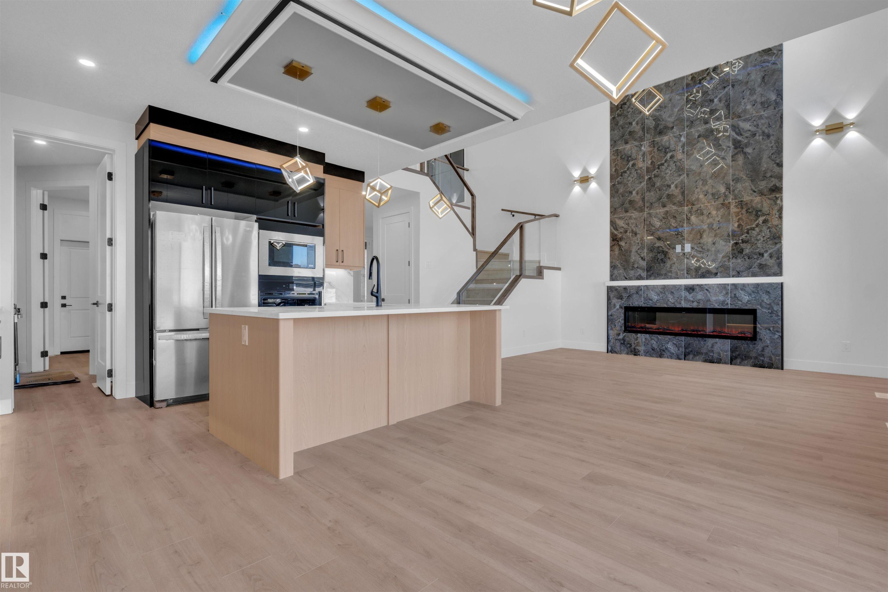 417 Pine Point(E), Leduc, AB - Indoor Photo Showing Kitchen With Fireplace