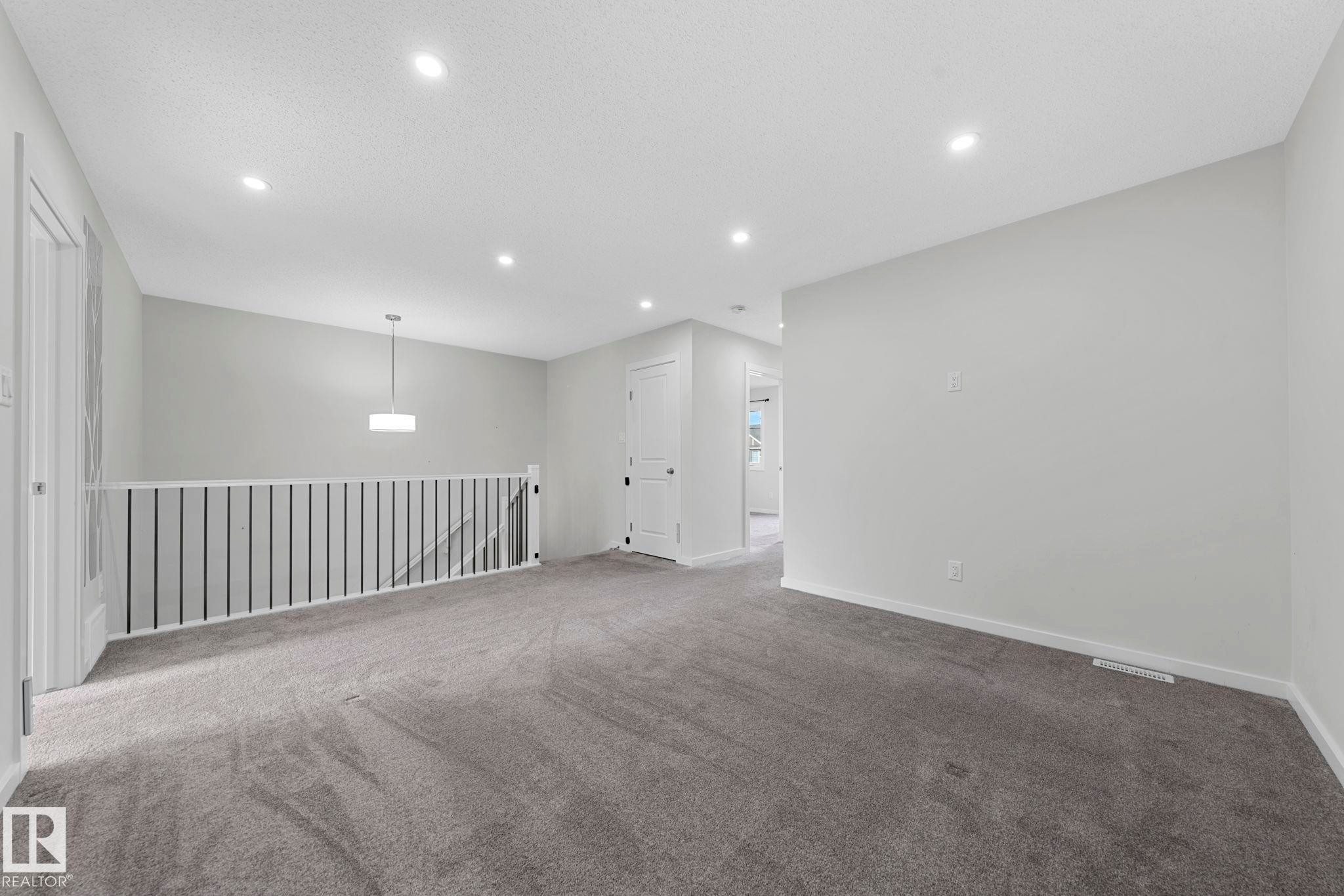 Unfurnished room featuring carpet flooring and recessed lighting - 1813 Collip View View, Edmonton, AB - Indoor Photo Showing Other Room