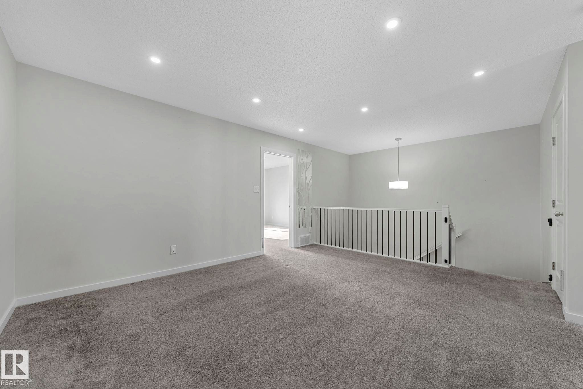 Empty room with carpet, recessed lighting, and a textured ceiling - 1813 Collip View View, Edmonton, AB - Indoor Photo Showing Other Room