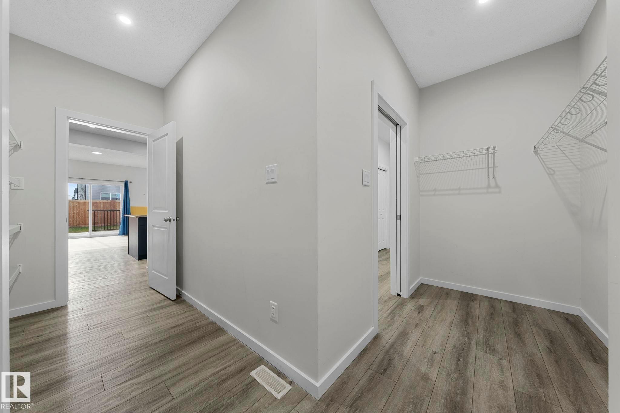 Corridor featuring recessed lighting and light wood-style floors - 1813 Collip View View, Edmonton, AB - Indoor Photo Showing Other Room