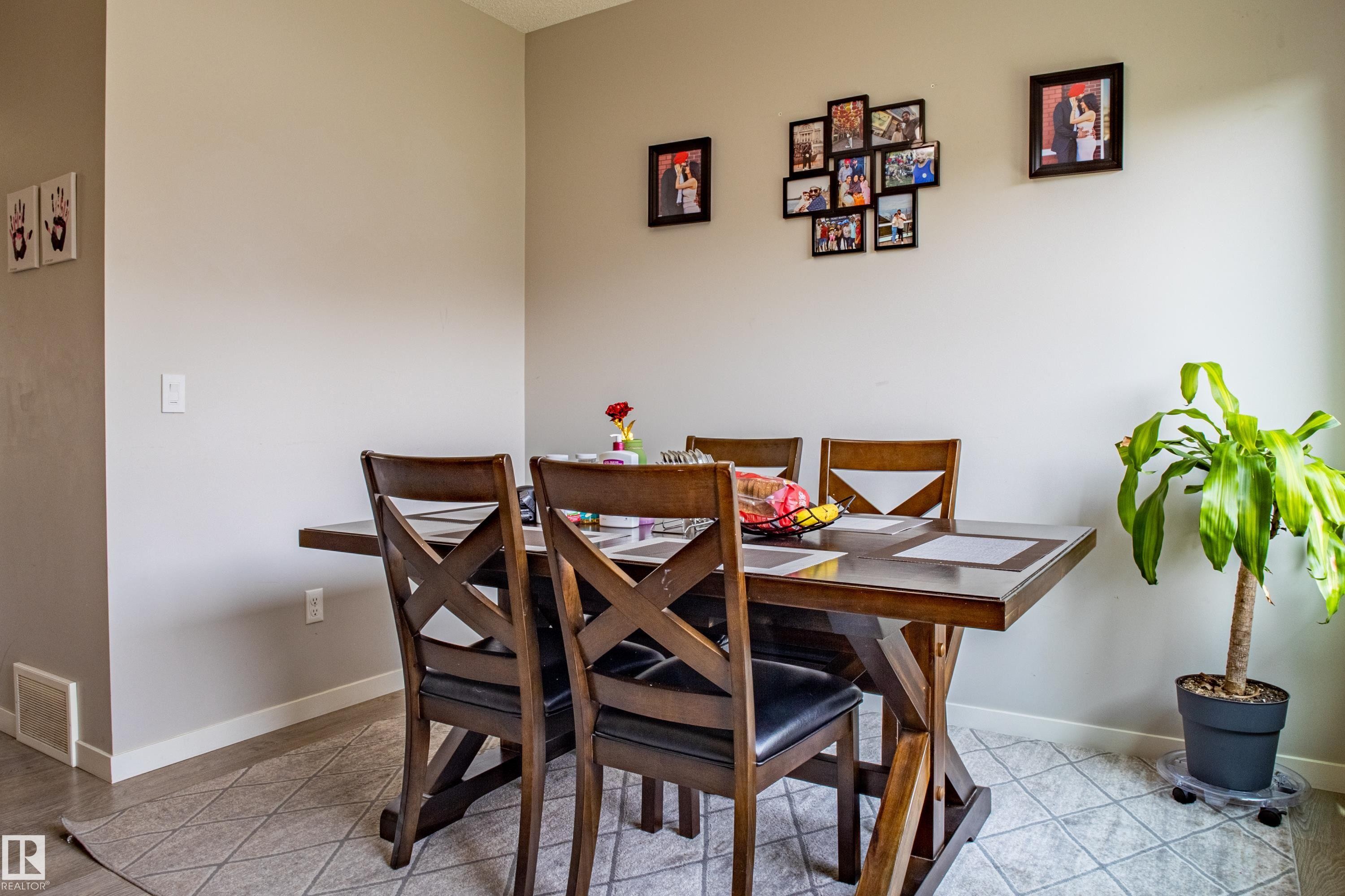 Dining space featuring light tile patterned flooring - 2407 Casey Link, Edmonton, AB - Indoor Photo Showing Dining Room