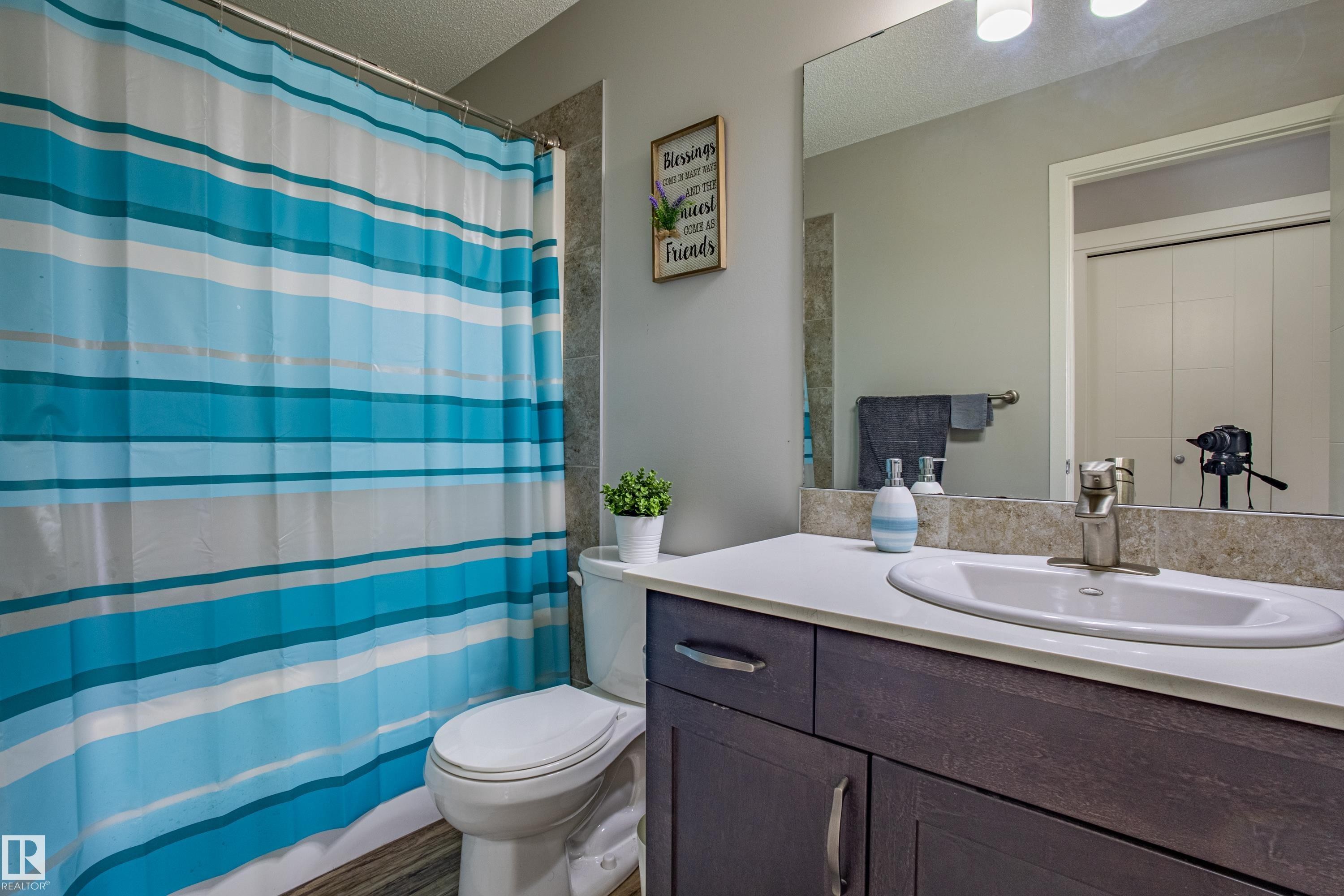Bathroom with vanity and a textured ceiling - 2407 Casey Link, Edmonton, AB - Indoor Photo Showing Bathroom