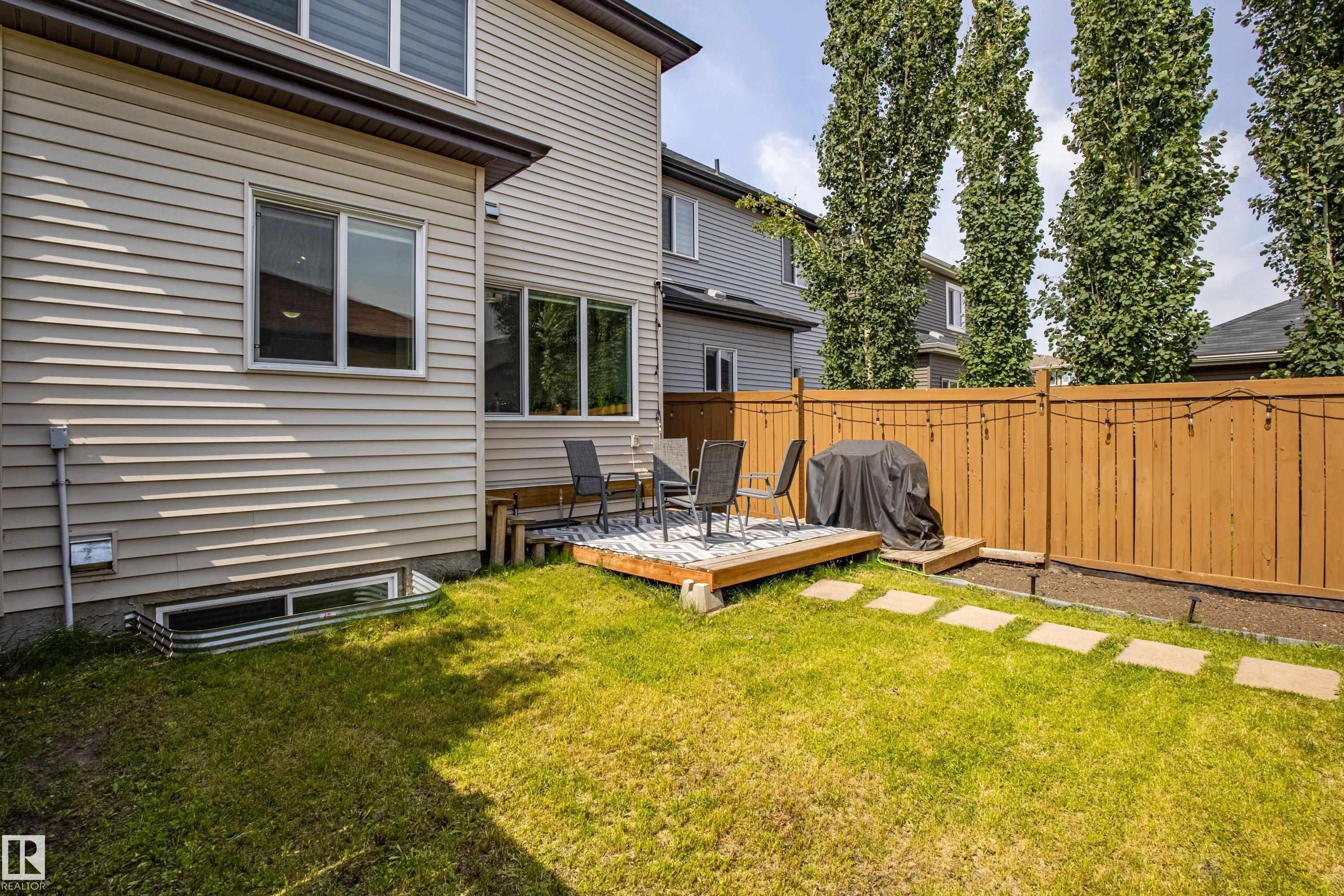 View of yard with a wooden deck - 2407 Casey Link, Edmonton, AB - Outdoor With Deck Patio Veranda
