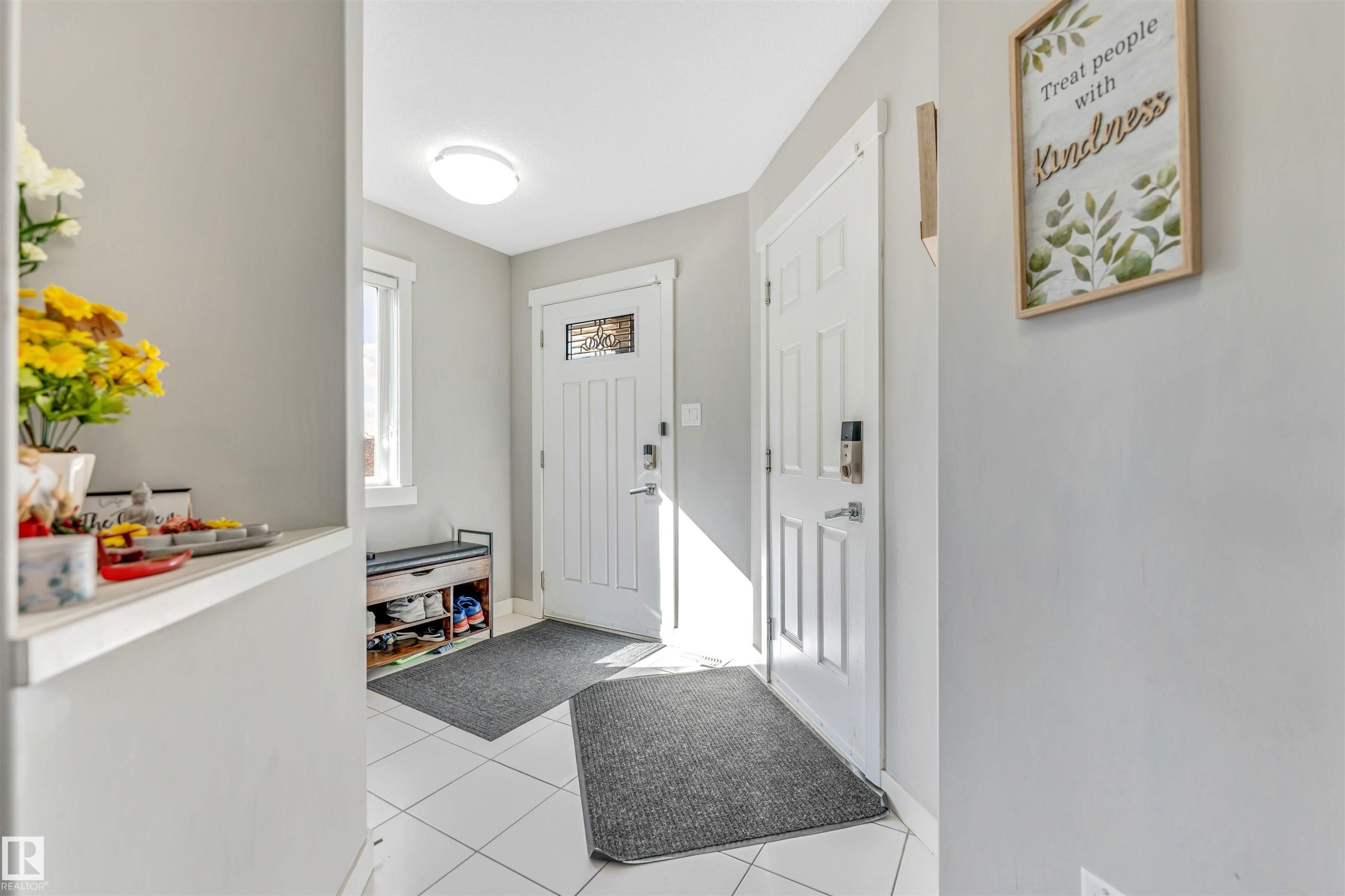 Entryway featuring light tile patterned flooring and baseboards - 3478 Weidle Way, Edmonton, AB - Indoor Photo Showing Other Room